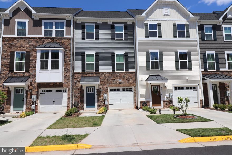 Beautiful only ONE year old home (2025 new construction) with approximately 2,340 square feet has four finished levels, the home includes four bedrooms, three full bathrooms, two half bathrooms, and a one-car attached garage. The main level is open with gourmet kitchen, stainless steel appliances large island and a spacious living room. Upstairs is the master suite with walk in closet and private full bathroom. Two other bedrooms and another full bathroom. Top floor has fourth bedroom, full bathroom and rooftop terrace with amazing views. Walking distance to Costco, target, Harris Teeter, and plenty of diverse restaurants. Community includes a newly constructed family oriented pool area, playgrounds basketball and tennis courts. From the community entrance you can see on one side all of Loudoun, and on the other side all the way to Reston town center. Truly living up to its name of “Loudoun View”