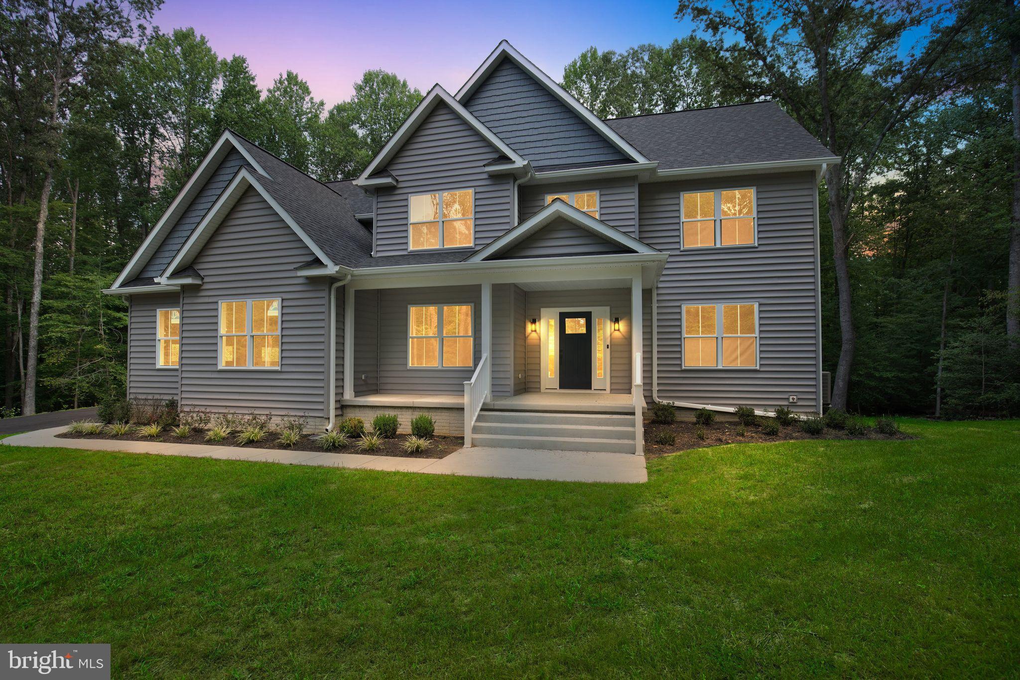 Available Now! New Custom Home in Queentree, Mechanicsville MD. This newly built home offers a thoughtful layout with flexible spaces. The main level features engineered hardwood floors, a welcoming foyer, formal dining room, private study, and a spacious great room that opens to the kitchen and breakfast nook. The kitchen includes a large island, ample cabinet space, a walk-in pantry, and connects to a mudroom off the 2-car garage, which is equipped with a 240V outlet for EV charging. Solid-core doors are used throughout the home for added durability and a quality feel. Upstairs, the primary suite offers a generous bedroom with engineered hardwood flooring, a large bath, and a walk-in closet. Three additional bedrooms, a bathroom, and a separate laundry room are also on this level. A bonus room provides extra space for play, fitness, or a second office, and includes access to a generous attic storage area of approximately 300 sq. ft. The unfinished lower level features multiple large open areas and rough-in plumbing for a future full bathroom. In total, the home offers 3,068 finished square feet plus a 1,301 square foot unfinished basement, giving a combined 4,369 square feet of living space. All of this is set on 3 private, wooded acres with no HOA, offering a serene setting surrounded by nature.