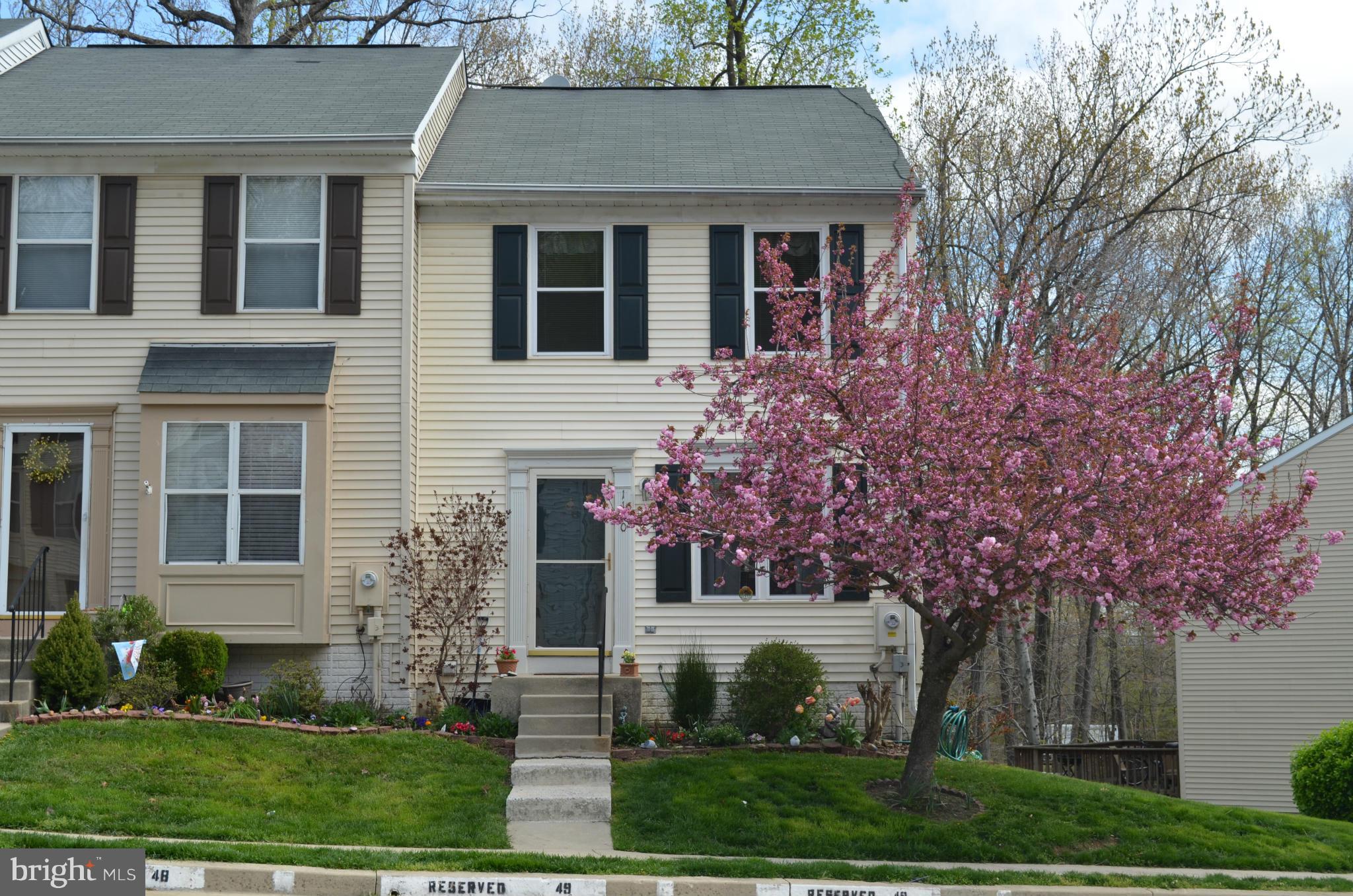 The Three L's of Living in one great home: LOCATION! End-unit TH, backs to woods, a stream & close to 95, 695, 295, UMBC, BWI, MARC, Amtrak, Patapsco Park, & more. LIFESTYLE! Quiet street, & you'll NEVER have to mow. Condo fee takes care of grass, snow, roof, everything. LUXURY! Remod kitch. w/granite, remod bsmt w/built-in bar, pellet stove & new full bath. KIDS? Relay Elem. Best value in Balt Co
