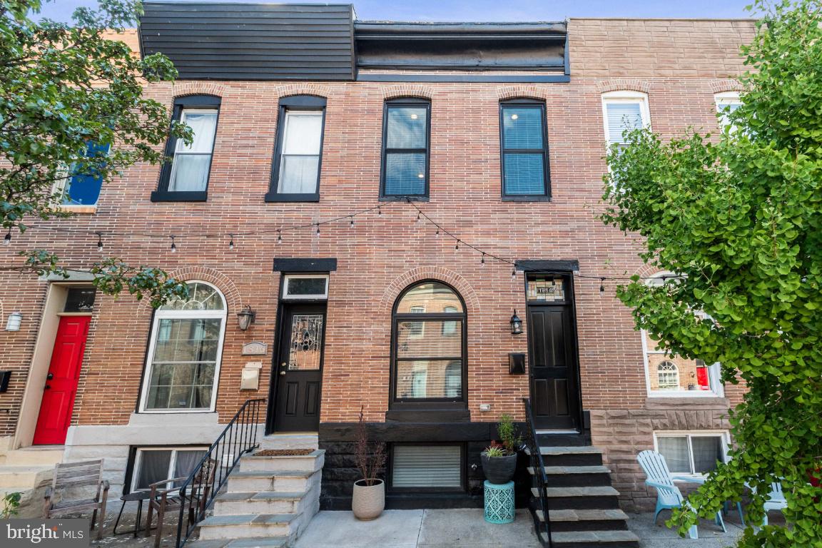 Beautifully renovated Federal Hill home with off-street PARKING on a quiet street! Enjoy gleaming hardwood floors throughout and an open floor plan boasting a spacious kitchen with center island, pantry, stainless steel appliances and granite countertops. The 2nd level boasts a private primary suite with large walk-in closet, linen closet and primary bath with dual-sink vanity and spacious shower. Another bedroom and full bath complete the 2nd level. The lower level features the 3rd bedroom and full bath, den/bonus room and laundry. Whole house audio system and center hall access to the coveted rooftop deck!