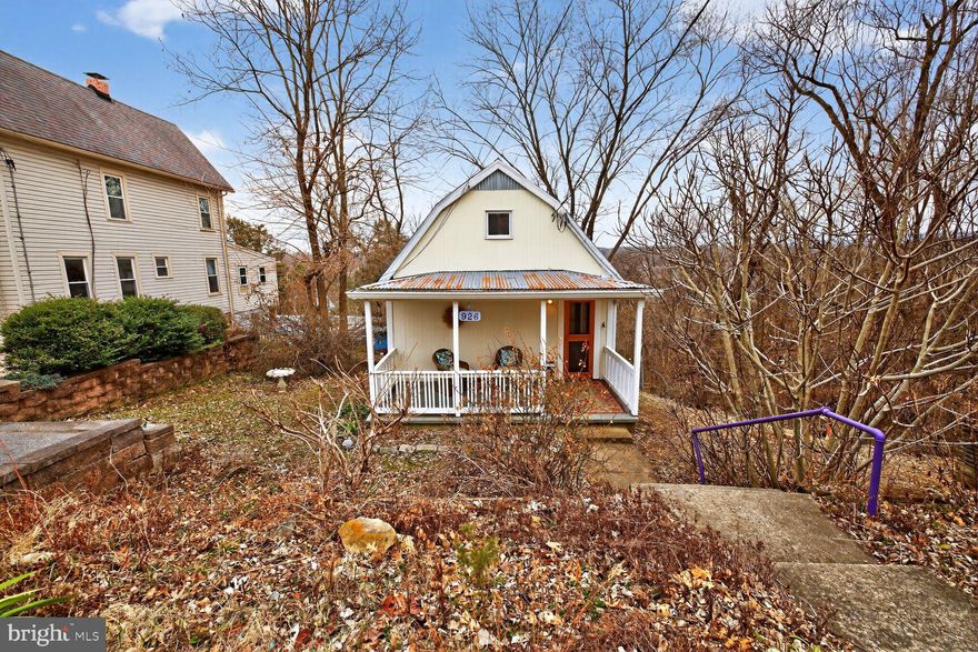 The definitive adventure basecamp awaits. A detached home at a condo price point offers unmatched freedom for the DC commuter and outdoor enthusiast. This 1910 cottage delivers a high-efficiency tiny home lifestyle with over 1,000 square feet of finished living space across three levels. Perched high above the river on a secluded hillside, you enjoy panoramic Potomac and mountain vistas without the concerns of a flood zone. The main floor is designed for contemporary comfort, featuring central heating and A/C, public water and sewer, and a streamlined kitchen with stainless steel appliances. The living area flows directly onto a back deck, perfect for taking in the views. The upper level includes the primary bedroom and a versatile loft area, which is ideal for a home office thanks to available Xfinity high-speed internet. Unlike typical small-footprint homes, this property features a fully finished 400 square foot walk-out lower level. This cozy retreat is anchored by a warm woodstove and includes a full bathroom and a flexible guest zone with a clever sleeping nook. Located a scenic 10 minute stroll from the Brunswick MARC station and local dining, you are also steps from the C&O Canal towpath and the Appalachian Trail. Enjoy fee-simple ownership and a vibrant, walkable lifestyle with no monthly HOA fees. Due to its unique construction and age, this property is best suited for Cash or Conventional financing and is sold as-is.