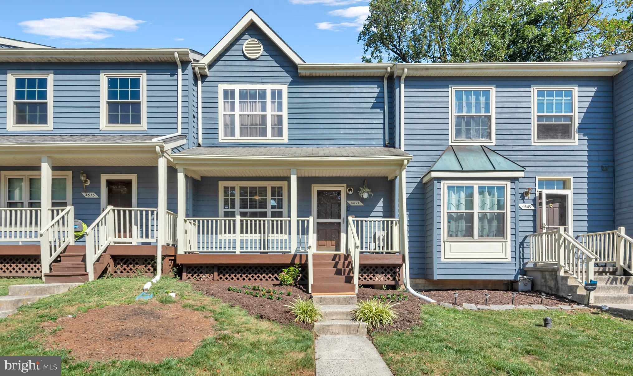 Welcome to 4611 Mews Drive, a beautifully maintained home in the sought-after Five Oaks community of vibrant New Town, Owings Mills. From the moment you arrive, pride of ownership is evident. The inviting front porch, a rare feature in this neighborhood, sets the tone for the warmth and character inside. Step through the door to find gleaming hardwood floors that flow through the foyer, kitchen, and half bath.
The updated eat-in kitchen is a true highlight, featuring stainless steel appliances, gas cooking, and granite countertops—perfect for everyday meals or entertaining. Just off the kitchen, the light-filled living room creates a cozy gathering space and opens through elegant French doors to a spacious deck, ideal for relaxing or hosting friends. Upstairs, the generous primary bedroom is joined by two additional bedrooms, all sharing a beautifully updated bathroom with a soaking tub and separate shower. The finished lower level offers incredible flexibility with a large recreation room and an additional office/den. Guests will feel right at home here, and with a bathroom rough-in already in place, there’s potential to easily add another full bath. Ample storage and a utility room complete this level.
Not only has this home been lovingly cared for, but it’s also been thoughtfully upgraded for energy efficiency, with a hybrid water heater and a fully insulated attic. All of this comes with the unbeatable lifestyle of New Town—community pools, parks, trails, shops, dining, and more are just steps away, with major commuter routes and the Metro conveniently close by. Move-in ready with numerous updates throughout, this home offers the perfect blend of comfort, convenience, and community living.