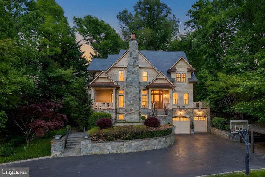 Tucked within Bradley Hills Grove, one of Bethesda's most quietly prestigious enclaves, 8819 Chalon Drive sits on a private half-acre that feels removed from everything while being effortlessly close to all of it. Burning Tree Country Club & Bethesda Country Club are minutes away. Downtown Bethesda, with its acclaimed restaurants, boutiques, & Metro access, is just a short drive. Wildwood & Cabin John Shopping Centers + Parks and trails are right around the corner.  This is the best version of suburban living: genuinely peaceful, genuinely connected, & surrounded by neighbors who feel the same way about both.

The house was custom built by Patrick Keating & it announces itself before you even reach the front door. Cedar shingle siding, architectural detailing, & a sweeping front lawn give the home a presence that is both distinguished & deeply inviting.

Inside, the home is an entertainer's dream in the truest sense. Real bones, real warmth, & a floor plan that manages to feel both grand & intimate at once. The main level is anchored by several living areas providing incredible flow. Not one but two sunken living areas, each with its own stone fireplace, the kind of architectural move that creates genuine moments within a home, spaces that pull people in & keep them there.  A more formal living space with custom built-in window seat, a perfectly framed perch that captures natural light & invites you to settle in plus a gorgeous deck that extends the main level outdoors effortlessly.  Morning coffee, afternoon tea, cocktails as the light fades through the trees. It becomes part of your daily rhythm without you even realizing it. Rich sand-in-place hardwood floors, detailed millwork, & considered proportions flow throughout, while the great room with its coffered ceilings & custom built-ins adds yet another layer of character & scale. Open enough to host a crowd, cozy enough that two people never feel lost in it.

The chef's kitchen sits at the center of it all, appointed with stainless steel appliances, quartz surfaces, a marble backsplash, & an oversized island with prep sink, opening seamlessly to the breakfast area & great room so that whoever is cooking is never separate from whoever is gathered. Formal living & dining rooms provide elegant counterpoints for the occasions that call for them.

Out back, the outdoor living space unfolds as you walk under a beautiful pergola onto a large flagstone patio with an outdoor kitchen, a wood-burning fireplace, & stone seat walls that define multiple gathering spaces, intimate enough for a quiet evening & expansive enough for a proper party. The wooded, private grounds wrap the entire property in a sense of retreat that makes the outside feel just as considered as the in.

Upstairs, four generously scaled bedrooms each enjoy their own ensuite bath. The primary suite is exceptional, with a recently renovated spa-inspired bath featuring a soaking tub, an oversized shower with integrated speakers, & elevated contemporary finishes. A custom-built bar area within the suite completes a private, hotel-like experience that makes the space feel like a destination in its own right.

The lower level is where the home's versatility fully reveals itself. A massive family room with its own fireplace creates an extraordinary casual gathering space. A dedicated game area, a separate gym or flex room, & a full bedroom suite with private bath round out the level with genuine flexibility. An oversized two-car garage & ample driveway parking mean the practicalities are just as well considered as everything else.

 Unparalled craftsmanship on a private half-acre in Bradley Hills Grove. This is the one.