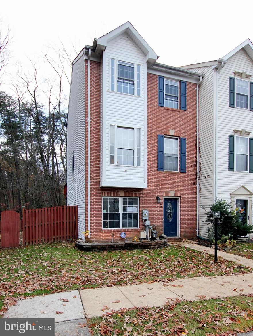 Three-level, end unit townhome in desirable Severn location. This home is priced for condition at well below the comparable homes for a buyer who wants to take a hands-on approach to personalizing their new home. This floor plan includes a ground level den or possible bedroom and family room that opens out to the patio and extra-large fenced backyard. The mid-level is the main living space with open concept living room/kitchen/dining area and sunroom with hardwood flooring that flows throughout, 42" cabinets, granite counter tops and access to the deck. The primary bedrooms features, vaulted ceiling, walk-in closet and a bath with soaking tub, separate shower and skylight.  While this home needs some work, it has some great features to start you off in the right direction. The location is near Fort Meade, NSA, shopping, schools, parks and the BW Pkwy. Property is being sold "As-Is". Seller will not make any repairs.