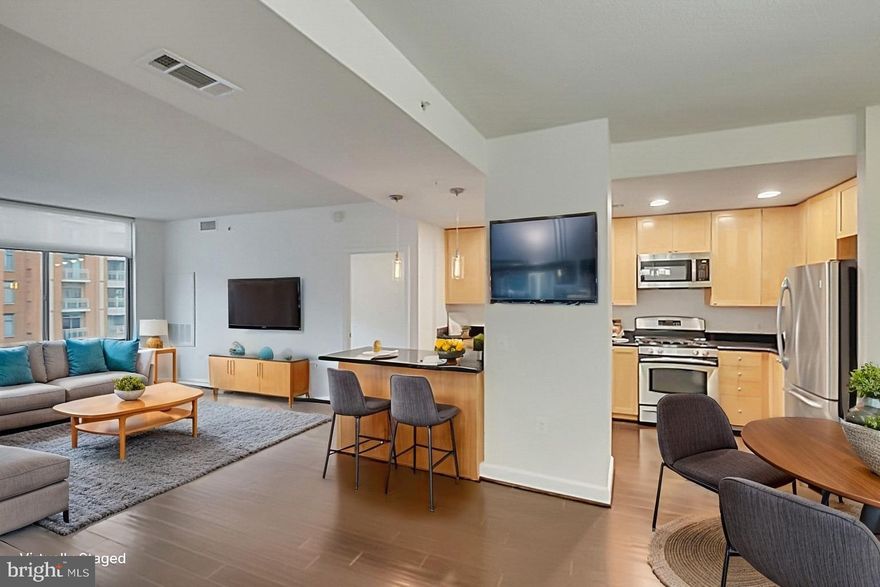 Luxury High Rise with Two Master Suites at The Eclipse on Center Park.  Natural Light fills this Open Floor Plan from the Rich Wood Flooring to the Bright Recessed Lighting. Modern Kitchen with gorgeous granite countertops, shiny stainless steel appliance and breakfast island that makes a great work station.  Washer and Dryer included in your unit! Private balcony overlooking a manicured courtyard. Start living the good life as you enjoy 24 hour onsite concierge service, restaurants, shops, child care, bike share program as well as excellent ammentis with an onsite pool, rec room, movie room,  fitness room and roof top terrace overlooking the Potomac River. This unit also includes two (2) assigned parking spaces and a storage bin. Located within two miles of I395 and adjacent to transit stop with direct service to Metro and Reagan National Airport. Call to View Today.