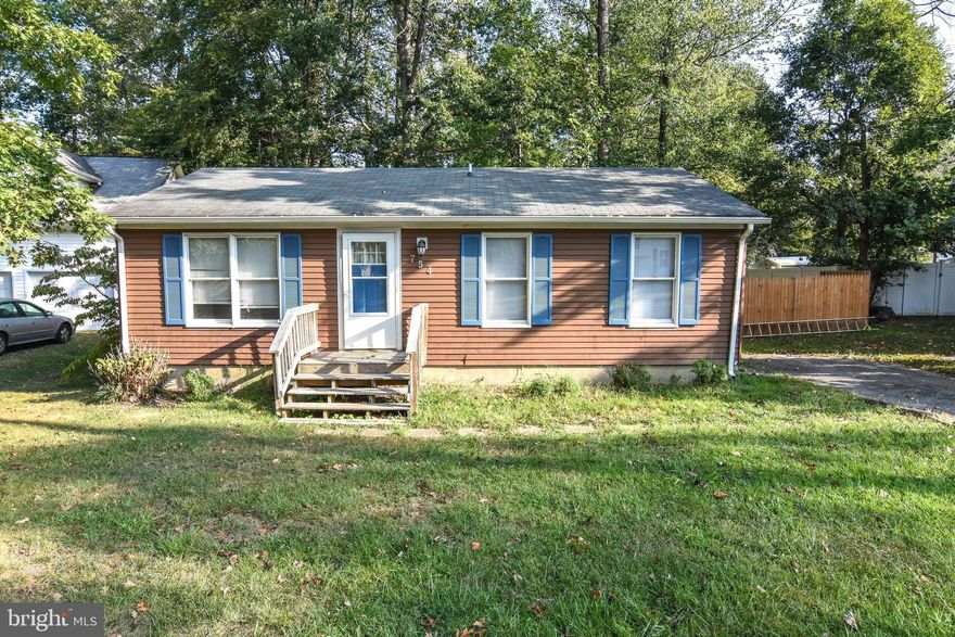 CHARMING 2 bedroom, 1 bath rambler on large, fenced-in flat lot in Chesapeake Ranch Estates. This COZY COTTAGE is the perfect rental for a family! Enter into a large family room with plenty of windows bringing in natural light and beautiful laminate flooring throughout.  The family room is open to your dining area, and you can't miss the HUGE FLAT YARD as you look through the sliders leading out to your deck, great for entertaining. The kitchen has stainless steel stove and dishwasher and plenty of counter space for prep and cabinets for storage. Down the hall, you'll find a laundry closet on your right, the full bathroom on the left and two bedrooms at the end of the hall, including the primary. Don't miss your opportunity! APPLY TODAY!