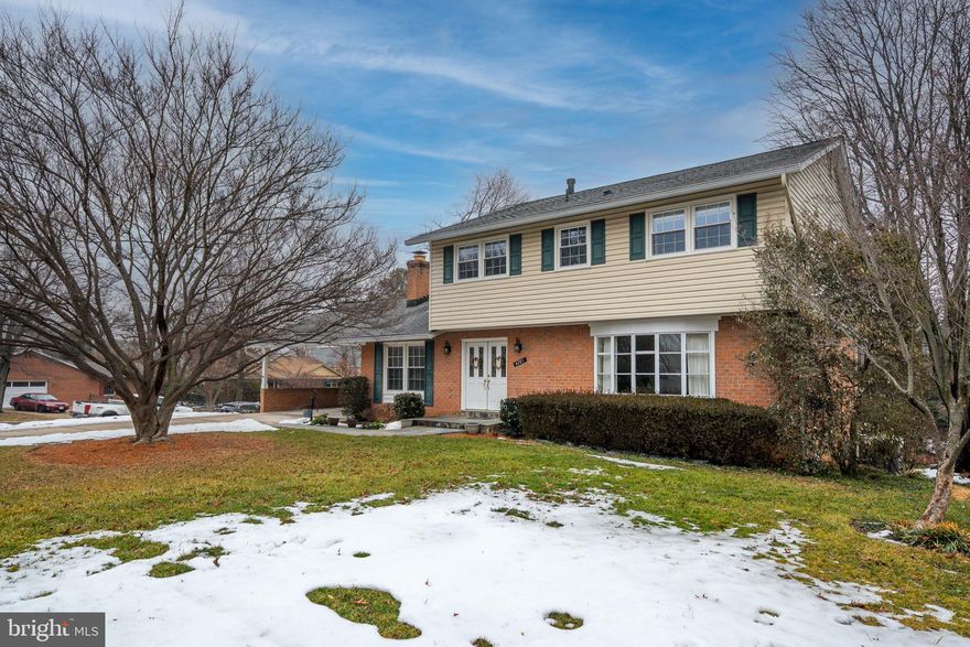 Welcome Home to 4201 WYNNWOOD DRIVE, ANNANDALE, VIRGINIA  22003 — where timeless elegance meets everyday comfort in the premier Wynfield neighborhood. Set on a quiet, tree-lined street inside the Beltway, this stately 5-bedroom, 3 full and 1 half bath Colonial offers the perfect blend of sophistication, comfort, and functionality. From the moment you arrive, the home’s charming curb appeal, expansive driveway and convenient two-car carport create a warm and inviting first impression. Step inside to a welcoming foyer with custom ceramic tile flooring and discover beautifully updated living spaces designed for both entertaining and everyday living. The gourmet kitchen serves as the heart of the home, featuring stainless steel appliances, custom soft-close cabinetry, granite countertops, a classic tile backsplash, and stylish updated lighting. Seamlessly open to the inviting family room, this space is perfect for gatherings and relaxed evenings alike. Direct access to the newly replaced deck from the kitchen, you will love the expansive outdoor area for grilling and entertaining family and friends.. The light-filled living room showcases a stunning front bow window overlooking the landscaped yard, while the elegant dining room is enhanced with updated designer lighting, chair rail, crown molding, and a large window framing views of the rear yard. Upstairs-- hardwood floors, updated lighting, and spacious proportions define the upper level. Three generously sized secondary bedrooms offer comfort and flexibility. The primary suite is a peaceful retreat complete with a custom walk-in closet and an updated ensuite bath featuring custom tile accents and a walk-in shower. A second beautifully updated full bath with tub/shower option completes the level. The lower level expands your living space with a modern recreation room featuring recessed lighting, attractive tile flooring, and direct access to the backyard — ideal for seamless indoor-outdoor living. A fifth bedroom with walk-in closet and lower level full bath with stall shower provides excellent flexibility for guests, an au pair, or private office space. Ample storage with additional cabinetry completes this level. Major updates provide peace of mind for years to come, including a new roof (2021), brand-new deck (2025), water heater (2024), gas fireplace (2025), HVAC system (2016), and more — showcasing the care and investment made in this exceptional home. Located inside the Beltway in the established Wynfield community, this home offers outstanding commuter convenience to I-395, I-495, and I-95, and is just minutes to DC, the Pentagon, Tysons, Old Town, National Landing, and Reagan National Airport. Enjoy being adjacent to Mason District Park with its farmers market, summer concerts, trails, dog park, and sports fields — plus nearby Pinecrest Golf Course, Green Spring Gardens, and abundant shopping and dining options. 4201 WYNNWOOD DRIVE offers space, thoughtful updates and an unbeatable location — truly a wonderful place to call HOME!