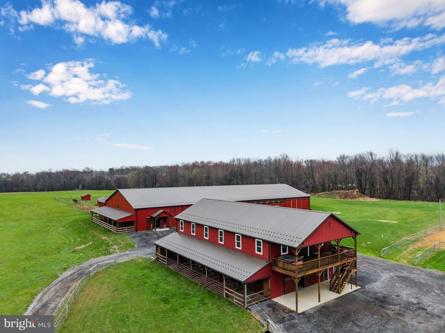 Exceptional equestrian property set on approximately 50 acres with two pole buildings.  Thoughtfully designed with purpose and functionality in mind, this property features numerous custom finishes throughout.
 
Building One: 40x84 with two stories, including a 1,800 sq ft barndominium with a covered porch facing west—perfect for relaxing while watching the sun set over the pastures. The living area features 2 large bedrooms, 2 full baths, and one half bath, enhanced by luxury finishes such as vaulted ceilings, a custom kitchen with granite countertops, and LVP flooring. The second story also includes a loft for additional hay storage. The ground floor barn area offers a 12-foot-wide aisleway, 6 stalls (5 with attached daylight runs), heated tack and utility rooms, a wash stall, and a sawdust bay. Also attached is an 18x70 garage addition with overhead doors at each end.

Building Two: 72x200 featuring a 72x120 indoor riding arena with sand footing over stone dust, a viewing area, 8 stalls (6 with attached daylight runs), a 14-foot aisleway, tack room, wash stall, hay storage above the stall area, and additional space for equipment storage.

Outdoors there is a 110x170 outdoor arena with sand footing and premium quality lighting.  Fenced pastures include two 5+/- acre pastures and two one-acre pastures, all with run-in sheds. On the west end of the property, a tree-lined area borders the Yellow Breeches Creek, while the remaining acreage has been used for hay production.

Professional photos and additional details will be added soon.  Experience the perfect blend of comfort and equestrian lifestyle—schedule your private tour today and see all this incredible property has to offer!