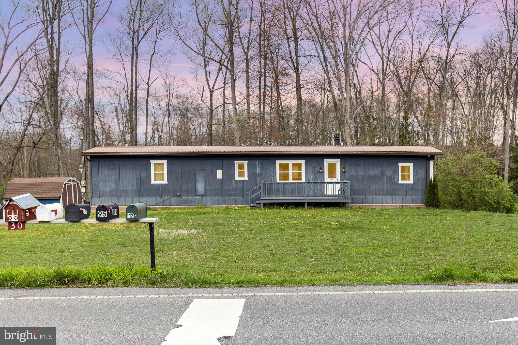 Welcome home to 745 Smokestown Rd! This 2.2 acre property  features a large cleared yard, wooded area, and a creek running through the property. There is a 2 bedroom, 2 full bathroom manufactured home on a permanent foundation on the property. There is a full unfinished basement walkout basement below the home as well, for your additional storage needs. There's also a large shed on the property for your outdoor storage needs. Whether you're looking to build a home on a large wooded lot, or looking for low cost living in the manufactured home, you have  many options with this beautiful property! Schedule your showing today! Seller is selling as-is.