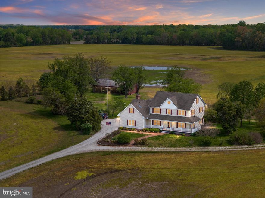 Back on the Market due to Buyer's FSA financing falling through. 
Welcome to Thanksgiving Farm, an exceptional opportunity to own nearly 100 acres of prime Eastern Shore farmland just minutes from charming small towns and within easy reach of Ocean City, Annapolis, and major airports. This versatile estate includes two parcels – one is a separate, buildable 13.81-acre lot, offering future flexibility or potential multi-generational living. Tucked at the end of a long private drive, the main home is a thoughtfully designed farmhouse that perfectly blends classic charm and practical living. The home features four spacious bedrooms upstairs, including a private primary suite with a sitting area, large bathroom, and direct access to a massive bonus room – perfect for a home office, yoga studio, sewing room, or playroom. The bonus room also has its own private staircase, making it a truly flexible space. On the main level, enjoy hardwood floors throughout, a light-filled kitchen that opens to a casual dining area and cozy family room with a wood stove. Just off the family room, a large screened-in porch overlooks the property’s picturesque fields, gardens, mature trees, and classic barn. A formal living room and dining room round out the main level, ideal for gatherings and entertaining. There’s also a convenient first-floor bedroom. The unfinished attic—with walk-up stairs, windows, and skylights—offers the potential for a bunk room, office, or gym, while the walk-out basement is ideal for a workshop or storage and connects directly to the attached garage. Outdoors, the land itself is the true star. Of the 99.81± total acres, approximately 70 are tillable—ideal for row crops or converting to a regenerative farm. Several low-lying areas create opportunities for duck ponds or managed impoundments. The remainder of the property is wooded and absolutely teeming with wildlife—whitetail deer, turkey, and more—making it a hunter’s paradise. A large equipment shed offers ample space for tractors, ATVs, RVs, boats, and anything else you can imagine. Whether you’re looking to work the land, create a multigenerational retreat, or simply unwind in the heart of Maryland’s farm country, Thanksgiving Farm offers endless possibilities.