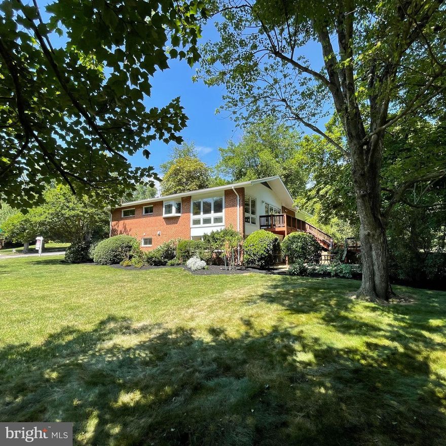 Come and see this beautiful midcentury home in sought-after Dowden Terrace, West Alexandria!  5 bedrooms/flex rooms, 2 updated bathrooms,  fully updated gourmet kitchen, Pella floor-to-ceiling patio windows, 2 wood burning fireplaces, 1-car attached garage, semi-open concept upper level, and fully landscaped large corner lot yard. Property is across to park land.   So many features makes this a stunning home.   This home features spacious upper level main living area, large Pella-brand floor-to-ceiling picture windows that let the sunlight pour in, gourmet kitchen with gas cooking and plant bay window, separate dining and living room spaces, 2-tiered Deck that leads to flagstone patio; 3 bedrooms & 1 full bathroom on the same level.   Upper level also has original and custom hardwood floors throughout, 1 of 2 brick wood-burning fireplaces, recessed lighting throughout, and stunning lighted built-in custom cabinets in both Living Room and Dining Room. Updated kitchen has gas stove that's a combination gas cooktop and electric stove - perfect for that gourmet cook! Kitchen also features full-size refrigerator, built-in microwave, double-sink, plenty of cabinets and counter space, granite counters & custom Maple wood cabinets giving this space a fresh and classic vibe.   Lower level features stylish midcentury stairway with vintage iron railings, large picture windows throughout, large inviting Rec Room with 2nd wood-burning fireplace and alcove entry area with access to the flagstone patio and street level.  Lower level also has 4th & 5th bedroom/flex rooms each with built-in bookshelves,  2nd full bathroom,  laundry room, and utility room with tons of storage!  If you like enjoying the outdoors, this is the place for you! This home is nestled in the park-like setting of Dowden Terrace neighborhood surrounded by Dora Kelley Nature Park and Holmes Run Trail parks that include walking and biking trails, playground park, and a plethora of flora and fauna to enjoy year-round. Dowden Terrace membership pool located  1 block away.  Dowden Terrace is a super convenient community with access to Metro & Dash bus stops, I-395, schools, restaurants and retail shopping approx 1.5 miles, approx. 5 miles to Old Town Alexandria waterfront, less than 10 miles to Amazon HQ2, Reagan National Airport, The Pentagon, National Harbor; approx 15 miles to Tysons Corner and Ft. Belvoir; approx 60 minute drive to many well-known wineries and breweries, not to mention award winning restaurants, entertainment and parks.  Property being sold "As-Is" and in excellent condition.   Marketing brochure, upgrade list & floor plan, fixture list, offer guidelines, and MLS disclosures are all available online on MLS listing.   Seller retains right to set an offer deadline and accept an offer outside of deadline.  Listing agent lives in the community and can speak to the are amenities. Contact listing agent with any questions. Hurry to see this beauty - won't last long!