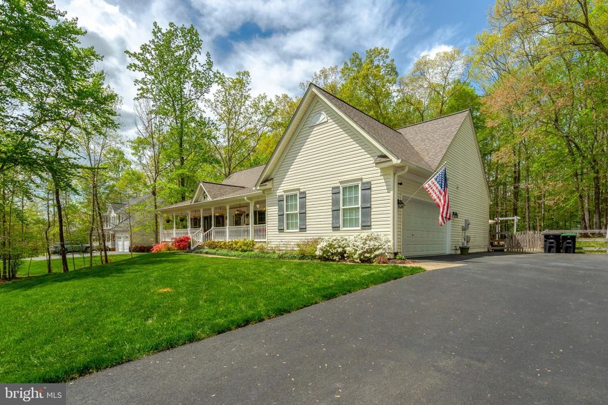 Welcome to 6812 Lochmere Court, Manassas, VA 20112. This beautifully updated raised rambler, built in 1999, sits on a private 1.03-acre lot and is completely move-in ready. Every major update has been done for you—starting with a stunning kitchen remodel in 2021. The kitchen is a showstopper with new cabinets, sealed quartz countertops, and an oversized island perfect for entertaining. It’s outfitted with a smart stainless steel stove,  a stainless steel refrigerator with icemaker and water dispenser, and a stainless steel  dishwasher. Hardwood flooring runs throughout the main level, and recessed lighting adds a modern touch—everywhere except the bedrooms. The cozy family room features a vaulted ceiling and a gas log fireplace, seamlessly open to the kitchen. It’s a rare and desirable layout offering true main-level living.
The spacious primary bedroom also boasts vaulted ceilings, a ceiling fan, great natural light, and a large walk-in closet. The remodeled en suite bath (2021) is pure luxury: double vanity, oversized walk-in shower, freestanding soaking tub, new toilet, updated lighting, and new flooring. Two additional main-level bedrooms share an updated hall bath (2018), with new flooring installed in 2023. Additional features include a smart thermostat, a whole-house fan, and loads of thoughtful details. As you enter the downstairs, notice the beautifully updated stairs. The finished lower level is built for entertaining. There’s a custom bar with Italian tile, which continues throughout the basement flooring. An 85” TV conveys with the home—perfect for movie nights or watching the big game.
You’ll also find two bonus rooms (not to code for bedrooms) ideal for a home office, gym, craft room, or guest space. A full bathroom, laundry room with wash sink and storage cabinets, and tons of extra storage round out the lower level. The washer, dryer, and even the second refrigerator and freezer can convey.
Exterior highlights include: 24-zone irrigation system, Updated garage flooring, Wood split rail fence (2017), New roof and gutters (2018), Water Heater 2024, New shutters (2021), HVAC 2013, Driveway sealed (2021), Power installed for an above-ground pool, Firepit area perfect for roasting s’mores, Large covered front porch with Trex decking and vinyl rails, Covered rear sunroom with high ceilings and ceiling fan, opening to a large concrete patio with party lights.  This home truly checks every box—style, space, comfort, and updates. Schedule your showing today—homes like this don’t last long.