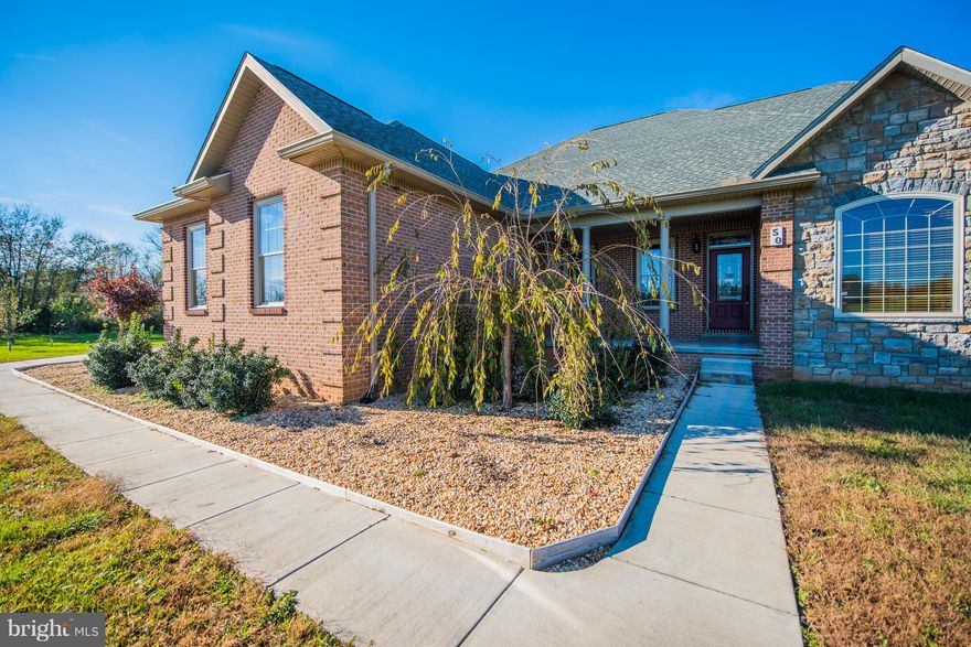 Simply stunning home, exceptionally built and maintained. One level living in this all brick contemporary rancher.  Expansive and luxurious hardwoods on the main level of this split floor plan. House is centered on almost 4 acres, rear fenced area already in place.  Horses allowed in this community. Potomac River community access has dock, boat ramp. Gated community in North Berkeley, easy to I81.