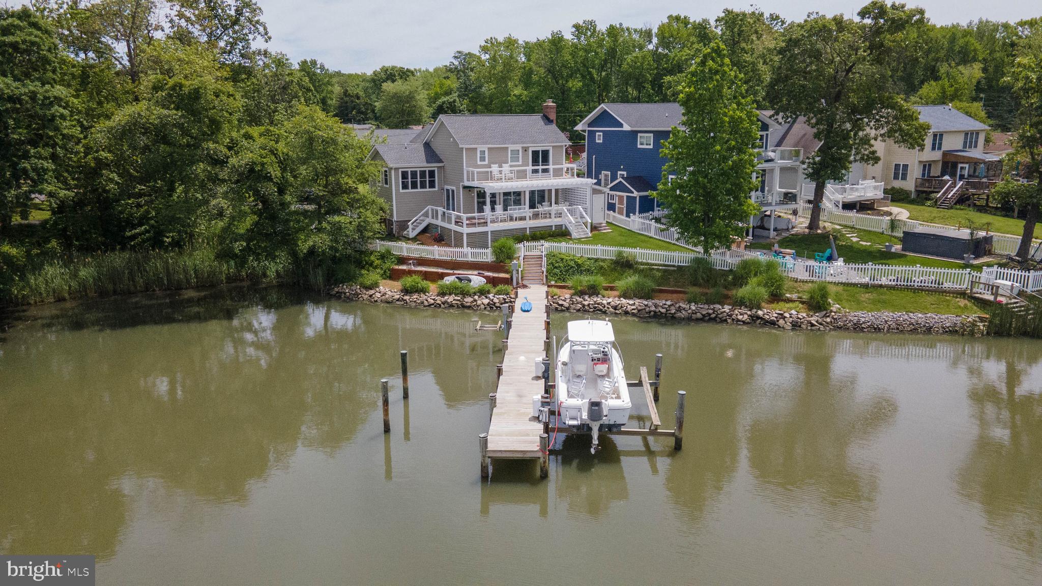 Welcome to this beautifully updated waterfront home, offering an unparalleled living experience with breathtaking views and luxurious amenities. Nestled along serene waters, this 4-bedroom, 2.5 bathroom gem features an office that can be easily be converted into a 5th bedroom, providing ultimate flexibility to suit your needs. The heart of the home is the fabulous kitchen, equipped with top-of-the-line appliances, sleek countertops, and custom cabinetry-perfect for both everyday meals and entertaining. The open-concept living areas provide seamless flow, allowing you to enjoy the stunning waterfront vistas from every angle,
Step outside to your own private paradise, where a spacious dock with a boat lift and jet ski lift awaits-ideal for water enthusiasts and those who enjoy the waterfront lifestyle.
Imagine evenings spent watching the sky transform with vibrant sunsets, making every day feel like a vacation.
With its thoughtful updates and attention to detail, this home combines modern luxury with the tranquility of waterfront living.
Don't miss the chance to make this stunning property your own!