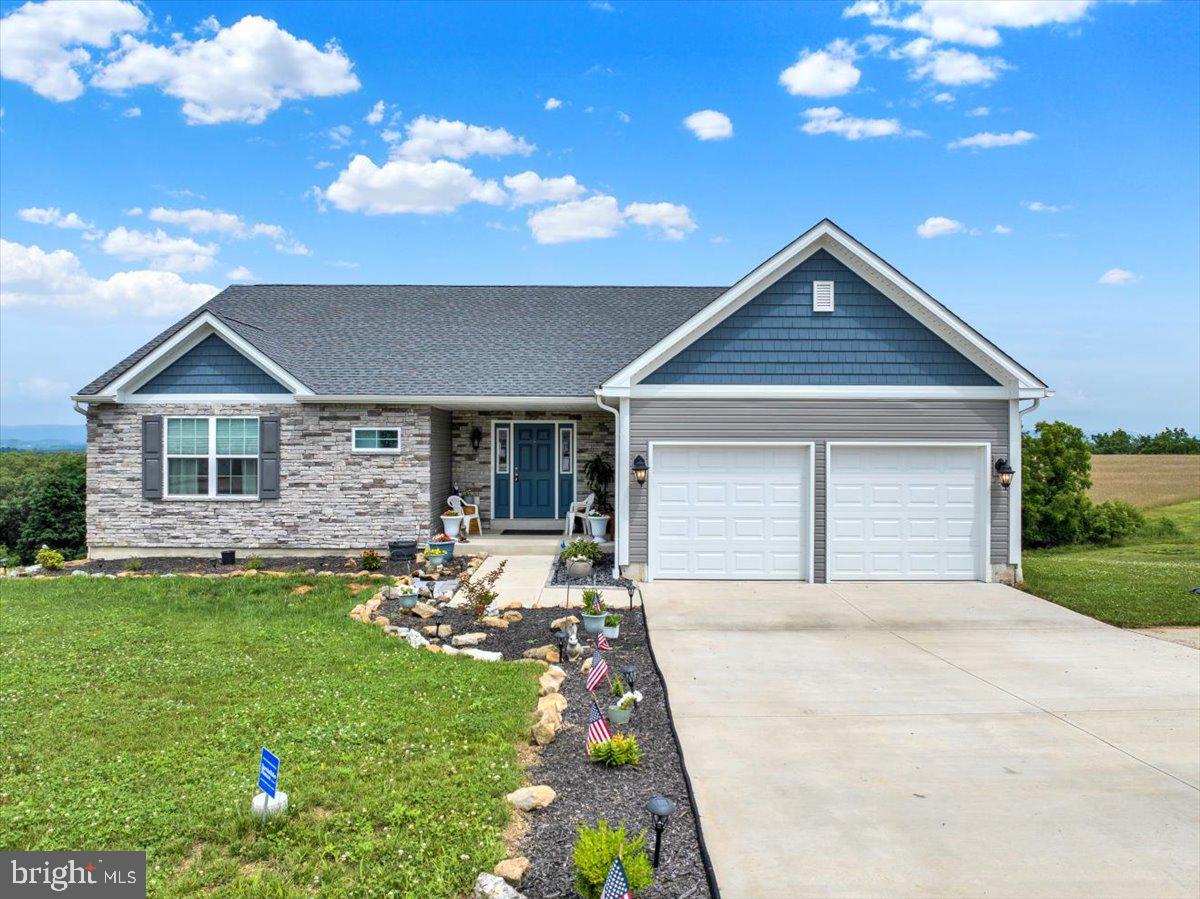 Don’t miss this nearly new ranch-style home in the desirable Schuylkill Valley School District!
Located at 203 Ida Red Drive, this beautifully maintained home offers the ease of one-floor living with over 1,700 square feet of finished space. Step inside to a wide foyer with two closets, leading to a bright and open floor plan. The spacious great room features vaulted ceilings and a cozy gas fireplace, while the adjoining dining room area opens through glass doors to a large deck with breathtaking, long-distance views. The kitchen is a showstopper, complete with a center island, granite countertops, subway tile backsplash, and stainless steel appliances, perfect for cooking and entertaining. The primary suite offers a relaxing retreat with vaulted ceilings, a walk-in closet, and a private ensuite bath. Two additional bedrooms, a full bathroom, and a generous laundry room complete the main level. Need more space? The daylight lower level offers approximately 1,500 square feet of unfinished potential, ready for your personal touch, whether it’s a future family room, home office, or added living area. A glass door provides convenient backyard access and fills the space with natural light, ideal for future expansion, patio plans, or more. Already in place is a two-zone invisible fence (front & back yard) that could easily be utilized by the new owners. All this, just minutes from everyday conveniences and major commuting routes, yet nestled in a setting that offers peace, privacy, and stunning country views.