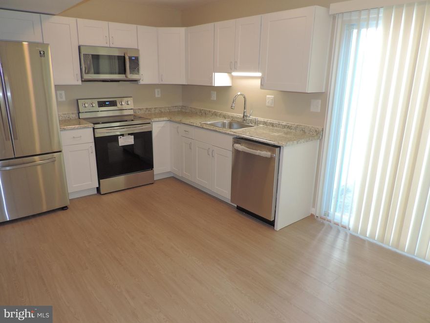 THIS BEAUTIFUL 3 BEDROOM, 1 1/2 BATH TOWNHOME HAS NUMEROUS UPDATES  AND IS MOVE IN READY.  Some of the updates include new carpeting & laminate flooring, new kitchen cabinets, new SS kitchen appliances, new washer & dryer, new front door & storm door, new light fixtures freshly painted and the list goes on...  Attached shed & fenced backyard.  Don't let the front yard fool you- Main water line repaired.  GOREOUS HOME SWEET HOME!