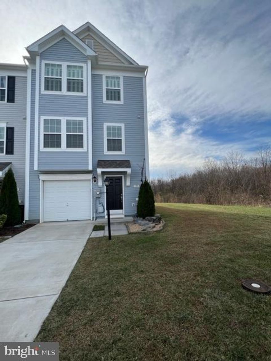 Nearly 2000 Square feet!!!! Prime location!!! This awesome townhome backs up to woods and provides great privacy with amazing views- Beautiful private end unit-3 level-3 Bedroom townhome in the Gallery Subdivision. This home features top of the line window shutters, hardwood floors and carpet, granite countertops, stainless steel appliances, full size washer and dryer, smart thermostat, alarm system and is wired for surround sound. The main level living space provides a large first level rec room and rear back door accessing the backyard. The second level offers an eat-in kitchen with open space and a large private deck. The third level delivers the  master bedroom and bathroom ensuite with two additional bedrooms and  a shared bathroom. Dont miss this beautifully appointed home!!!!