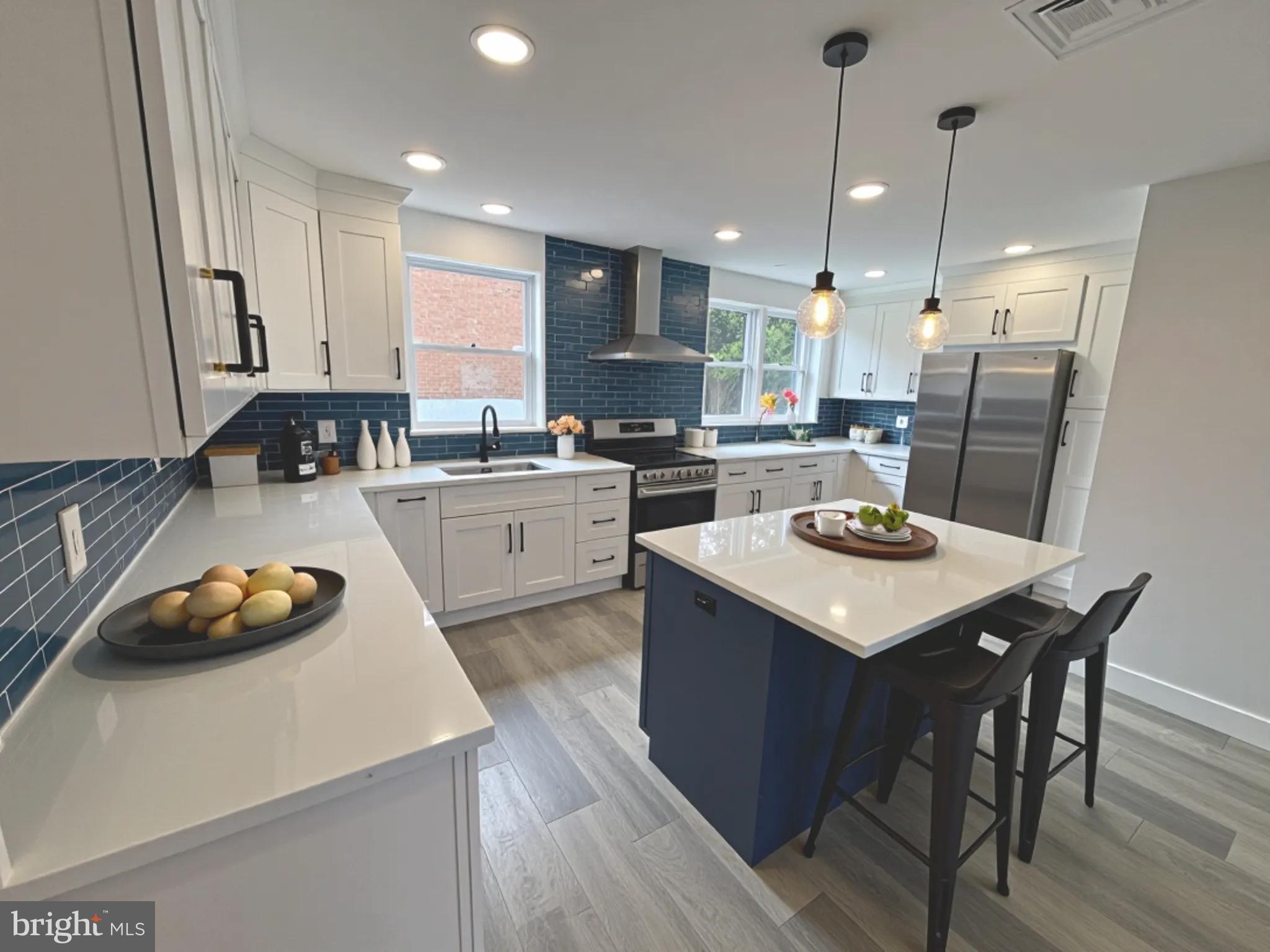 Welcome to 3244 Chesterfield Road, a fully renovated interior row home in one of Northeast Philadelphia’s most desirable neighborhoods. This stunning 3-bedroom, 2.5-bath property perfectly blends modern design and quality craftsmanship. Step inside to find a spacious open-concept layout featuring brand-new flooring, baseboards, and window trim throughout. The show-stopping kitchen is equipped with gorgeous quartz countertops, sleek white cabinetry, high-end stainless steel appliances, and a bar seating area—ideal for cooking, entertaining, and everyday living. The home features three completely brand-new bathrooms, including a luxurious private ensuite, a beautifully designed hall bath, and a stylish powder room on the main level—all updated with modern fixtures, finishes, and plumbing. Enjoy added peace of mind with newly installed hardwired smoke detectors throughout the home. Additional upgrades include central air conditioning, a new water heater, PEX plumbing and PVC drain lines, LED lighting, and contemporary fixtures. All front windows, interior doors, and the back door have been replaced, and the entire home has been freshly painted. The finished basement offers flexible home office, playroom, or media room space, and a separate utility and storage area. A front-loading washer and dryer are conveniently tucked away, making laundry day a breeze. The garage is fully finished, creating an ideal bonus area for a workshop, gym, or storage. Parking is easy with two dedicated spots in front and additional street parking for guests. Located directly across from the church and school, and just a short walk to local playgrounds and shopping, this move-in-ready home offers unbeatable convenience, comfort, and style. Don’t miss your chance to call 3244 Chesterfield Road your new home—schedule your showing today!