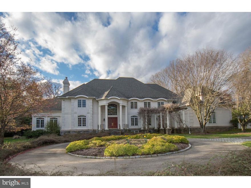 Stunning, classically styled French Manor home located on an exceptional 2.39  acre parcel on a cul de sac, offering unparalleled amenities including flat lawns, walled terraces, tennis court, pool and pool house outfitted with kitchen, bath and lounge area.  Approach the home by a wide paver turning circle to a custom mahogany door. Beyond find a two story Foyer with sweeping staircase and forward views of the Great Room.  Marked by soaring ceilings and full stone wall with gas burning fireplace this space radiates light from the over-sized windows and creates the open floor plan desired by today's buyers.  Also recognizing the need for more intimate space the formal Living Room located to the left of Foyer is warmed by a gas burning fireplace and Southwestern exposure.  The formal Dining Room enjoys the detail of a curved wall from the staircase behind and connects seamlessly to a Butler's Pantry, large walk-in shelved storage and the Kitchen. Outfitted with a tiered cooking and seated granite topped island the Kitchen opens to a wide walled stone terrace and magnificent low care perennial gardens and verdant lawns.  High level appliances including two Dacor wall ovens, gas cooktop and side by side sub zero refrigeration and freezer creating a space which is as functional as it is attractive.  A wide hall leads to a handsome Billiard Room/Office.  With three walls of windows, a sophisticated sound system and the forethought to locate unattractive but needed printers in a nearby equipment room, this space offers all possibilities for both hard work and recreation.  Completing the first level is a full Bath,  large Laundry/Potting room with plentiful storage and outside exit. Appreciate the second level overlook after ascending the main stairs en route to a deluxe Master Bedroom.  Generously proportioned with a tray ceiling the Master offers true end of day retreat with a Dressing Room, his and her outfitted closets, large Bath with under window jetted tub and separate water closet.  Two bedrooms offering equal square footage with en-suite baths and large closets. Two additional bedrooms with central bath could also be purposed as a grand Guest Suite located just off the backstairs and adjacent to the home's elevator.  Floored Attic provides superior primary storage or could be easily imagined as future finished space. Lower Level is finished with Bath, craft room, recreation area and large unfinished storage and mechanicals.