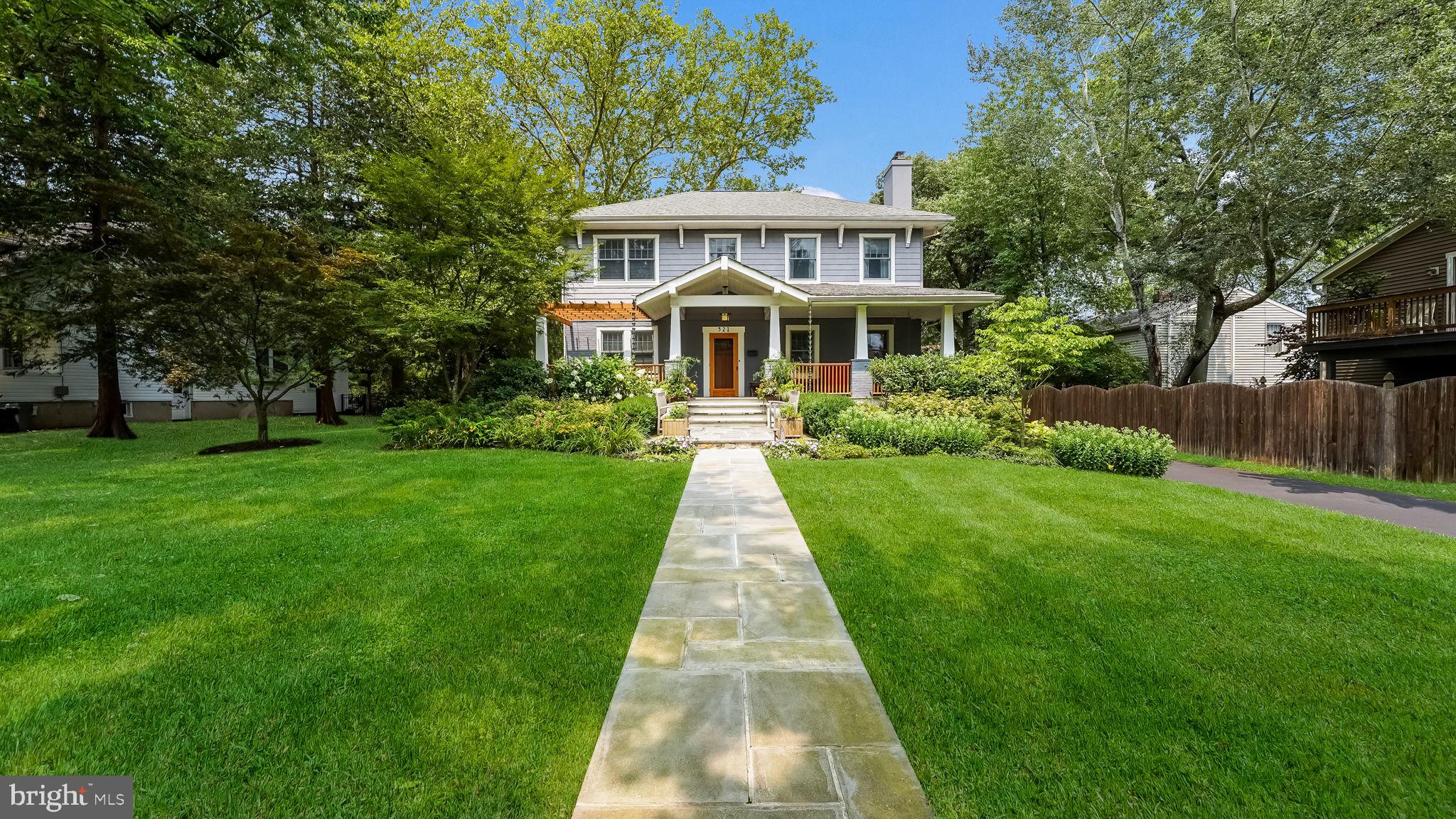 Welcome to 521 Maple Ave, a customized hidden gem located on one of Doylestown’s most prestigious streets. This artisan home is a modern splendor with historic charm and features a brand-new custom pool area in the private back yard. Excellent attention was paid to the extensive renovations and updates, with custom finishes and an eye for timeless detail. A Pennsylvania Bluestone walkway extends to the front porch with craftsman style accents and sets you up for a tour of this fabulous homestead.
The solid Fir wood front door welcomes you into the main floor, which is designed with an open floor plan in mind. There are custom millwork finishes, coffered ceilings, random width red oak hardwood floors and a wood burning fireplace to greet you. A private room anchors the front corner, perfect for an office, playroom, exercise space, art studio. Continue through the main floor to the kitchen area, and enjoy the honed granite countertops, stainless steel appliances, subway tile backsplash, copious cabinets, and how it flows seamlessly to the living area. Peninsula seating plus a light filled dining room with space for many to gather. The powder room was recently updated with a custom vanity featuring a handsome walnut inlay, designer wallpaper and a space saving pocket door.
Journey upstairs to the second floor where you will find three spacious bedrooms with generous closet spaces, an updated full bathroom, and a laundry area. The primary suite is well appointed and so spacious! Enjoy the built-in organizers at the walk-in closet, then rest and recharge in your five-piece bathroom, where you can soak in a beautiful free-standing tub or in the extra-large walk-in shower with glass doors, body sprays, and handheld shower fixtures. Radiant floor heat, plantation shutters and elevated finishes complete this magazine worthy space.
The lower level has a finished space perfect for a play space, exercise room, or extra living space. A half bath and additional cabinets add to extra features to this area of the home. Sitting on over a half-acre lot, with a detached one and a half car garage…this impressive home also offers an in-ground pool! The brand-new heated Saltwater pool was designed by Giorgio’s and features a spa, rock faced Bluestone coping, and gunite finished interior with sun shelf. Notice the extensive professional landscape/hardscape done by Mark Cook Landscaping, winner multiple years for Best in Show at PHS Philadelphia Flower Show, herringbone Pennsylvania bluestone decking, a natural gas firepit, and the sustainably sourced Fijian mahogany + steel wire mesh fence surround.
New smart Lutron lighting to the pool area and to the new shed, new slider and picture window in dining area, updated windows, new water sewer line, high efficiency natural gas heating and A/C systems, with a tankless hot water heater, waterproofed basement with extra storage, partial generator, extensive exterior water management solutions with three dry wells, and car charging outlet are just some of the additional features within this home. Enjoy all that the Boro has to offer- museums, charming shops, county theater, festivals, community, and restaurants.
