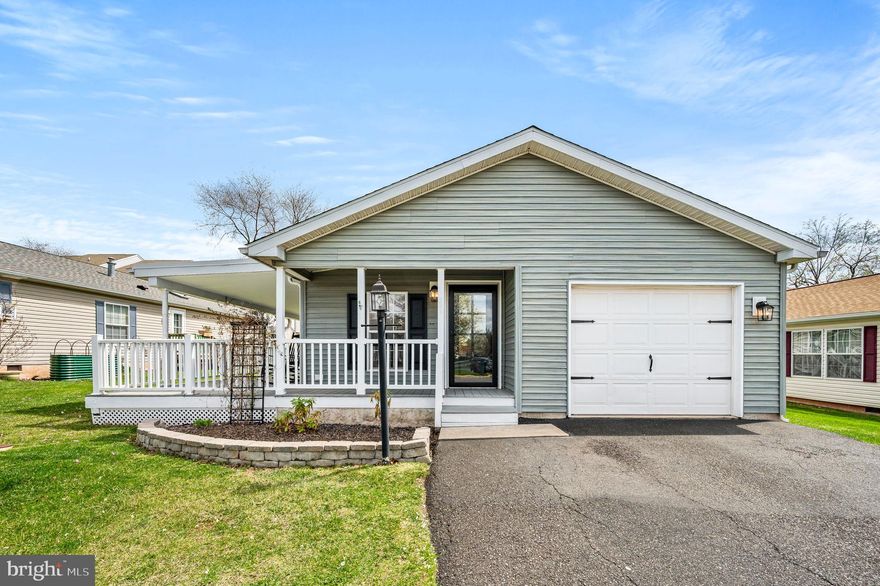 Why do the work when it’s already been done for you?  For the past two years, the seller has thoughtfully updated and maintained this beautiful home, so all that’s left to do is move in and enjoy.  This delightful 2-bedroom, 2-bathroom residence features a spacious covered wrap-around porch, a convenient one-car garage, and peace of mind with a brand-new roof.  From the moment you arrive, pride of ownership is evident.  Step through brand-new front doors into a bright and inviting living room with luxury vinyl plank flooring and neutral paint that flows seamlessly throughout the home.  The living space leads into a formal dining area and an updated kitchen, complete with quartz countertops, tile backsplash, new stainless steel sink and faucet, new stainless steel appliances (including a gas range), a Center island with storage, and a large pantry cupboard for extra storage.  From the breakfast area (which also houses a laundry closet), new sliding doors open to a cozy side deck — the perfect spot to sip your morning coffee and soak in the peaceful surroundings. Down the hallway, you'll find a generously sized secondary bedroom and a full hall bath featuring a new vanity, updated flooring, and a recently replaced skylight. At the end of the hall is your private primary suite, boasting a walk-in closet and a fully remodeled en-suite bathroom with dual vanity, tiled tub surround, new mirror, and modern fixtures. Other updates include new raised-panel doors with updated hardware, new trim, updated lighting fixtures, and new ceiling fans throughout the home. Willow Run offers fantastic community amenities, including a clubhouse and swimming pool, ideal for relaxation and socializing. The location is unbeatable — with easy access to restaurants, shopping centers (including Costco and the Limerick Outlets), medical facilities, and Route 422. Don’t miss this opportunity to enjoy low-maintenance, easy living in a beautifully upgraded home. Schedule your tour today!