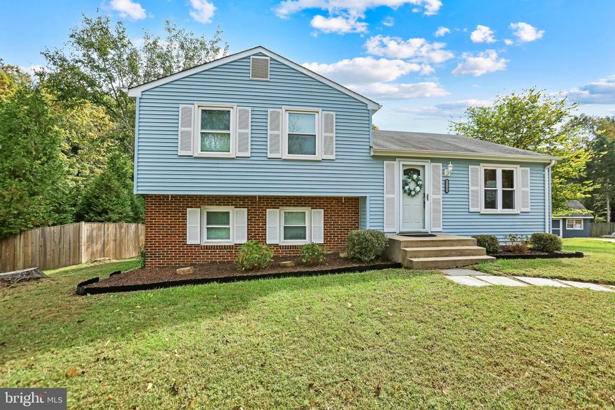 Welcome to 15303 Whispering Glen Court, a charming three-bedroom, one-and-a-half-bath split-level home set on a quiet cul-de-sac in the established Pleasant Hill community of Centreville. Surrounded by mature trees and lush greenery, this inviting property offers a perfect blend of comfort, privacy, and convenience.

The main level features a bright and open living area where large windows fill the space with natural light. Just off the living room is access to a spacious Trex deck, perfect for outdoor dining, entertaining, or relaxing evenings surrounded by nature in the large, private backyard framed by mature trees. The kitchen offers a functional layout with ample cabinetry and room for casual meals, making it both practical and welcoming. All windows were replaced less than two years ago, providing improved energy efficiency and a fresh, updated feel throughout the home.

Upstairs, you’ll find three comfortable bedrooms and a full bath, providing space for family, guests, or a home office. The lower level includes a cozy recreation room, a convenient half bath, and walk-out access to the backyard. Thoughtfully added owned solar panels enhance energy efficiency and help reduce utility costs, offering lasting value and sustainability for years to come.

Set on a beautifully landscaped lot, this home provides the peaceful retreat of suburban living while remaining close to everyday amenities. Nearby Ellanor C. Lawrence Park offers miles of wooded trails, athletic fields, and picnic areas, while residents can explore local favorites such as Sweetwater Tavern, Ciao Osteria, and The Winery at Bull Run, or enjoy the shopping and dining options at Centre Ridge Marketplace, Chantilly Crossing, and the sprawling Fair Oaks Mall. Weekend destinations like Cox Farms, Atlantis Waterpark, and historic Clifton are all within easy reach.

Commuters will appreciate the home’s convenient location near major routes including Route 29, Route 28, and I-66, providing seamless access to Fairfax, Tysons, and Washington, D.C. Dulles International Airport is also just a short drive away.