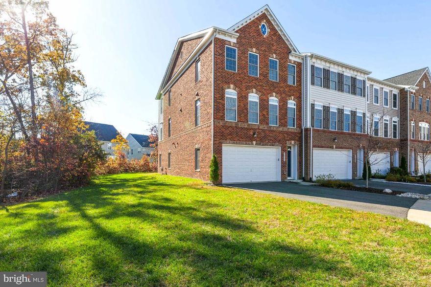 YOUR DREAM HOME AWAITS - this luxury, 2 car garage, end unit townhome is in perfect move in condition! ! Fantastic open floor plan! Gourmet kitchen with upgraded cabinetry, granite countertops, stainless steel appliances, and huge island with breakfast bar. Gleaming hardwood flooring throughout the main level and hardwood stairs with iron railings. Spacious owners suite features two walk in closets,  beautiful bath with glass shower, soaking tub, and double vanities with upgraded cabinetry.  Finished walkout basement and full bath. Loads of upgrades and only 5 years young! Located in Loudoun County, the Virginia Manor community of Dulles Farms includes over 14 parks, numerous walking trails and tot lots and a beautiful clubhouse and community pool.