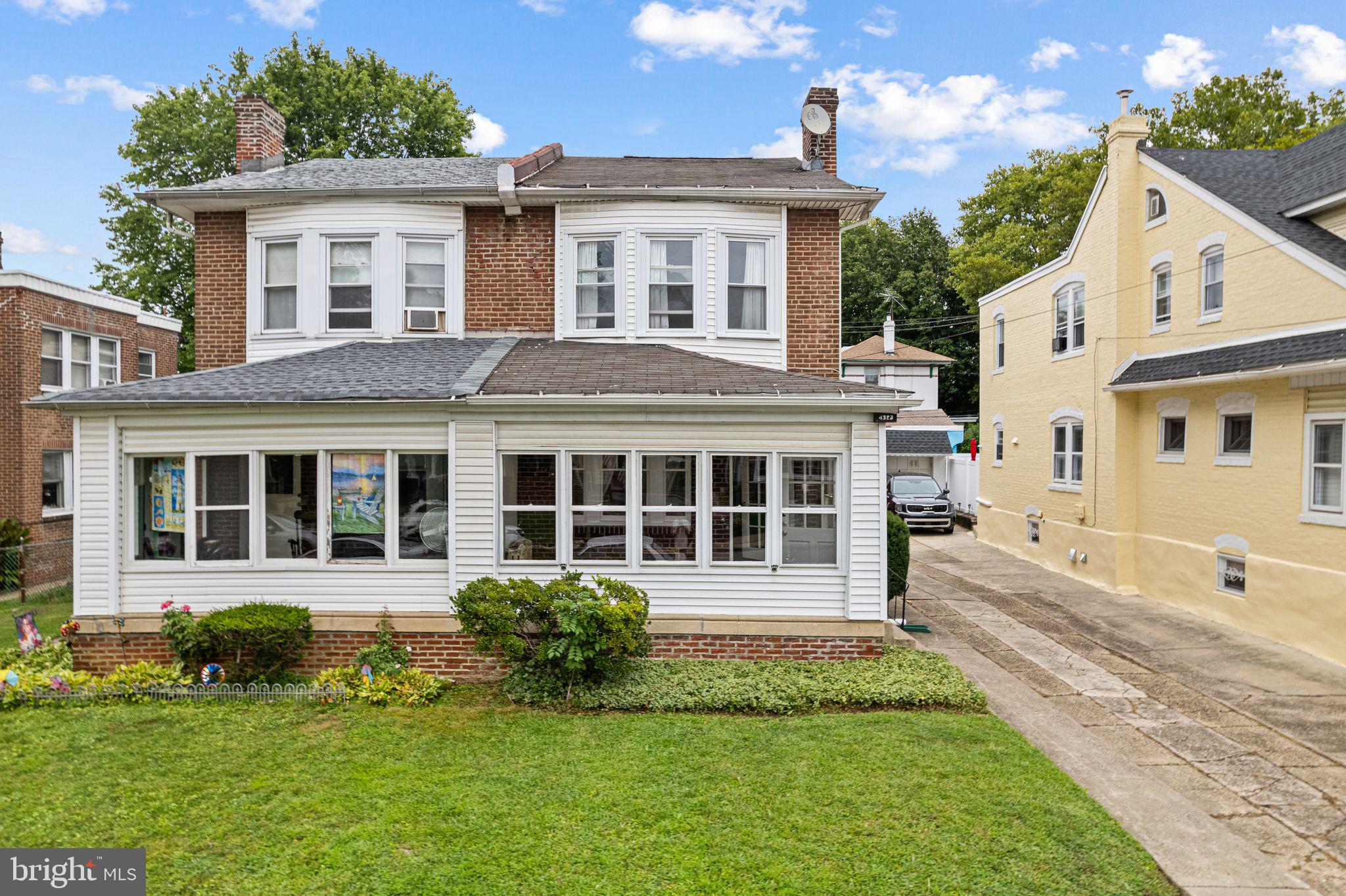 Welcome to this beautifully updated 3-bedroom, 2-bathroom home located on a tree-lined street in the heart of Tacony. Step inside through the inviting sunroom, perfect for relaxing or greeting guests, then into a spacious living room with a cozy fireplace that flows effortlessly into the dining area. The fully renovated kitchen is a standout, featuring sleek granite countertops, classic shaker cabinets, a timeless subway tile backsplash, and plenty of natural light making it a space you’ll love to cook and entertain in. Upstairs, you’ll find three bright bedrooms and a stunningly updated full bathroom with elegant tile finishes. The unfinished basement adds extra storage and a second full bathroom with a stall shower. Out back, enjoy a private deck and a generous yard ideal for outdoor gatherings or a quiet evening at home. A private driveway adds convenience and completes the package. This move-in ready home blends classic charm with modern updates. Don’t miss your chance to make it yours!