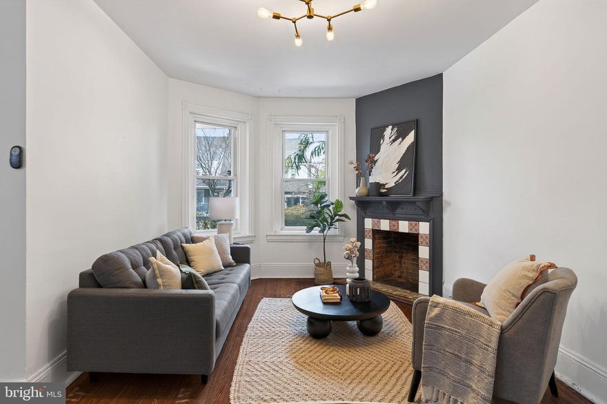 Welcome to 5110 Newhall Street, a 4 bed / 3 bath Victorian Twin tucked into a quiet side street of West Germantown that boasts historical charm, thoughtful updates, and plenty of space. This gem is 2200 sqft on a 25' wide lot, has central air, a finished basement, outdoor space, and original hardwood floors.

Enter through the front porch to a striking living room featuring tall ceilings and an ornate fireplace. Pass the main staircase to a large dining room that opens into the kitchen and mudroom. The kitchen has a second stairwell, quartz countertops, plenty of cabinet space and centers around an inviting kitchen inland, perfect for gathering and doing homework. The mudroom has built-ins for plenty of storage and a back door leading to a landscaped outdoor space. The entire first floor is lined with windows and has modern light fixtures throughout.

Heading upstairs, you'll find the front bedroom primary suite featuring an ornate fireplace and HUGE ensuite primary bathroom with a dual sink, jet tub, shower stall, walk in closet, and toilet closet. The best part is the second floor sleeping porch that opens off of the primary bedroom! A second bedroom (and full bathroom) are down the hall beyond the back staircase, and would be perfect for an office space or child's bedroom. The third floor also boasts two more bedrooms -- one of which has a Murphy Bed -- and another full bath, and would make a great guest suite.

The basement is finished and has plumbing for yet ANOTHER half bath and space for an office, workshop, workout room, or more flex space.

The outdoor area contains intentional touches, such as three large backyard planter beds with irrigation systems, a front yard native pollinator garden, yellow Carolina Jessamine that blooms along the front porch, and raspberry and blackberry along the side of the house.

This is a truly unique spot that has been updated with care; it's walkable to The Germantown Cricket Club, Attic Brewing, and Queen Lane train station, and a short walk or drive to Weavers Way - Germantown, Wayne Junction train station, and Jefferson University.