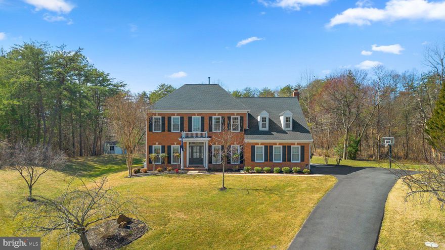 Welcome Home to Brittingham- a sought after community in Millersville with easy commuter access and a short drive to restaurants, shops & entertainment districted to Severna Park Blue Ribbon Schools!  121 Fordham Drive is a stately brick front colonial perfectly perched at the top of a cul de sac offering a private 3/4 acre lot with fabulous entertaining space, both indoors & outdoors!  Offering over 4,100 finished square feet across 3 finished living levels, there is space for everyone.  The main level boasts a 2 story foyer flanked by private home office and formal sitting room flowing to the dining room.  The chef inspired gourmet kitchen offers white cabinetry, granite counters, stainless steel appliances and a huge center island with seating plus space for a casual dining table all overlooking the sunken great room with double doors to the rear entertainment space and yard- all ideal for entertainment!  Covered patio and outdoor kitchen with built in grills & refrigeration.  A beautifully updated hall bathroom and laundry/mudroom off the garage complete the main living level. Travel to the upper level with a spacious primary suite complete with sitting area, walk in closet & private en suite bathroom with soaking tub, glass enclosed shower and dual sink vanity. 3 additional generously sized bedrooms and a full hall bathroom compete the space. The lower level offers a 5th bedroom, 3rd full bathroom, a large rec room with built in bar and home gym space plus great storage and walk up stairs to the rear patio. Designer neutral paint, updated light fixtures throughout and so many more updates throughout-Rear deck/Patio 2020, 2019, HVAC 2018, Windows/Doors 2015.
 Schedule your private tour today!