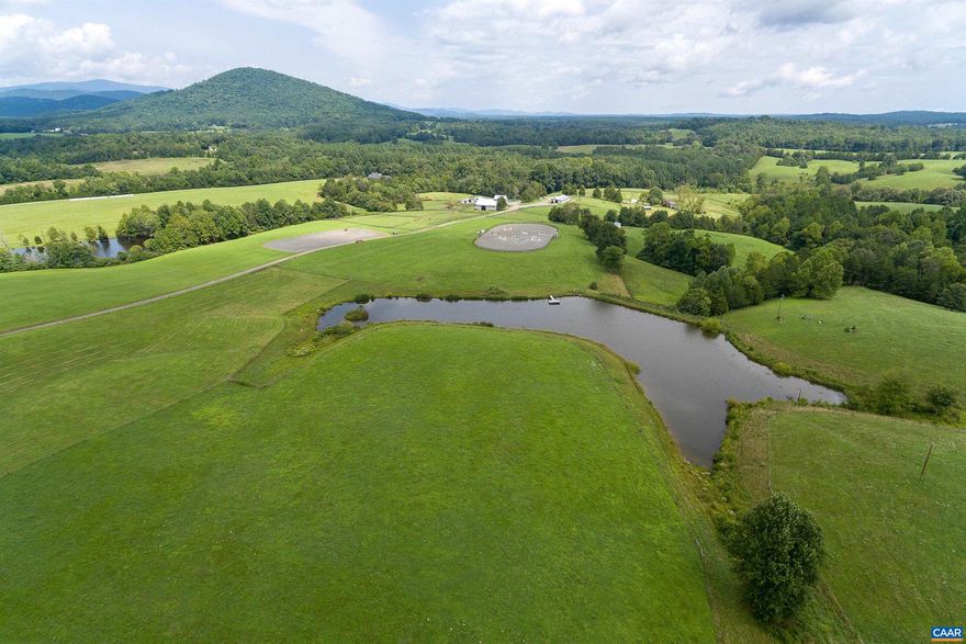 One of the few remaining farms in Northwest Albemarle County with over 100 acres that has division rights, no conservation easement, and spectacular Blue Ridge Mountain views. Less than 12 miles to Charlottesville and UVA. The land is predominantly in fenced pastures, with areas of  hardwood forest, and some pine, plus great water sources throughout the farm including springs, creeks and two lakes. One stocked lake is approximately 3 acres, and another is 4 acres in size - shared with a neighbor. THE VIEWS AND SETTING ARE SPECTACULAR!!! There are several great homesites with these big views, and numerous improvements for a farming operation, including a circa 1890 farmhouse with 3 bedrooms and 2 baths, a barn apartment, an 11 stall stable, hay barn, cattle barn and equipment shed.,Fireplace in Family Room
