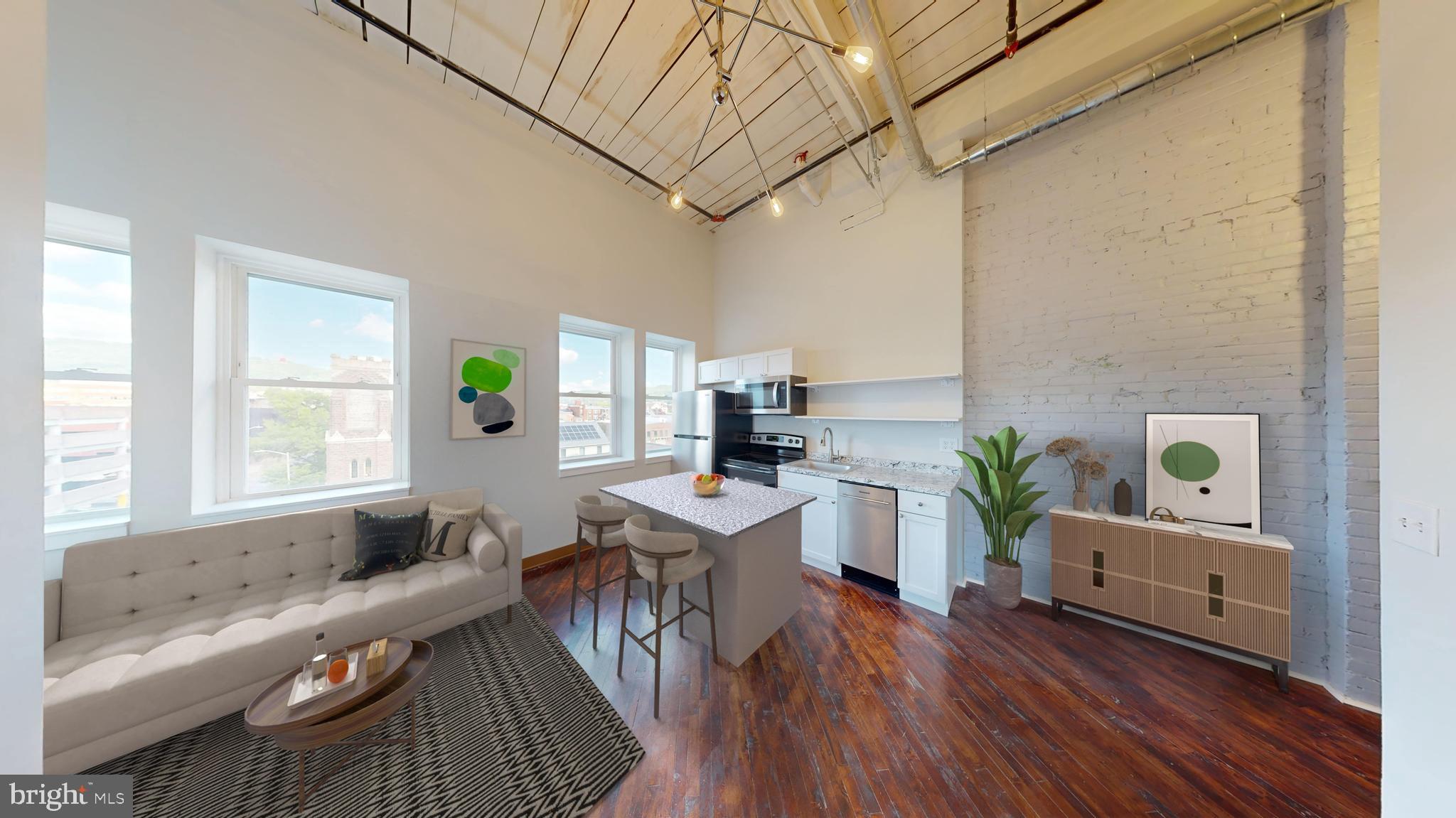 Welcome to Reading Lofts, a beautifully reimagined historic property located at 100 S. 4th St. in the heart of Reading, PA. This early 20th-century building has been thoughtfully transformed into a collection of studio, one-bedroom, and two-bedroom apartments, blending original architectural charm with modern updates for today’s renter.
Each apartment features bright, open layouts with soaring ceilings, restored wood or LVT flooring, and large windows that fill the space with natural light. The modern kitchens include stainless steel appliances, crisp white cabinetry, and contemporary countertops—designed for both style and functionality. Tile bathrooms and upgraded fixtures offer a clean, modern feel throughout.
Reading Lofts delivers a unique living experience that captures the character of a historic building while offering the convenience of modern amenities. Perfectly situated within walking distance to local restaurants, shops, and entertainment, it’s city living with classic appeal.
Schedule your tour today and discover life at Reading Lofts.
**Photos of similar unit