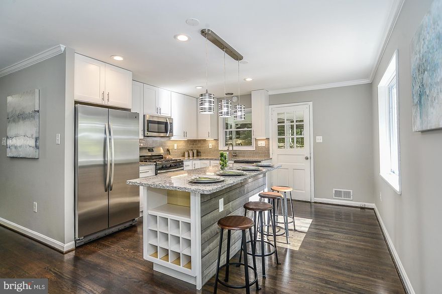 Completely Remodeled 4 Bedroom & 2 baths home.Over 1,900 sq.ft w/opt 5th bed/office.Brand new gourmet kitchen w/ oversized island, S.S.appliances,granite & open floor plan.Espresso HW floors, fresh paint & New windows throughout.Unbelievably spacious,fully finished L.L. w/ Family Room,1 Bed,1 office & 1 Full bath & sunroom porch.Great location,close to shopping,Huntington Metro,Ft Belvoir & I-495.