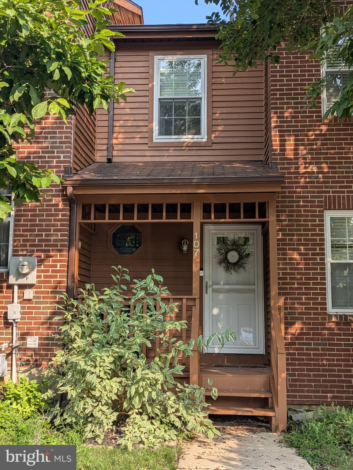 Welcome to a bright, thoughtfully updated townhome in sought-after Perkiomen Woods. A wood-and-brick façade opens to an airy main level with wide-plank floors, an open living/dining area, and a cozy corner wood-burning fireplace—perfect for gatherings. The eat-in kitchen shines with white soft-close cabinetry, granite counters, a rustic subway-tile backsplash, deep under-mount sink, and a 5-burner gas range. A convenient powder room and first-floor laundry complete the level. Upstairs, the vaulted primary suite offers double closets and an updated ensuite bath, joined by two additional bedrooms and a hall bath. The lower level features a versatile partially finished space with built-ins and a handy kitchenette, plus utility/storage. Outside, sliders lead to deck, made for entertaining, and fenced rear yard that backs to open common space—an easy-living extension of the home. Enjoy low-maintenance living with community pool, clubhouse, tennis courts, tot lot, and direct access to the Perkiomen Trail, all in award-winning Spring-Ford Area SD and minutes to Providence Town Center, Wegmans, and 422