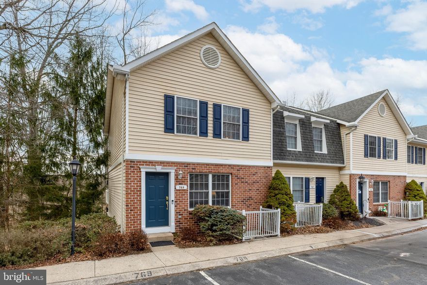 Delightful townhome in Sienna Woods—perfect residence or weekend retreat. This two-story dwelling offers a great location, care-free living, tasteful selections and finishes. Discover light-filled rooms, hardwood floors and a smart floorplan. The eat-in kitchen features a lovely breakfast bar and new stainless-steel appliances.  From the kitchen, step out onto the deck, perfect for entertaining while enjoying a private, tranquil setting. The main floor is complete with a spacious living room and a convenient half bath. Upstairs, you'll find two generous en suite bedrooms. The finished lower level offers an additional bedroom, a private full bath, and a versatile bonus room, ideal for creating your perfect rec room or entertainment space. The HOA includes essential services such as water/sewer, snow removal, exterior maintenance, and more, offering hassle-free living. Bonus: CATA service and just minutes from PSU, shopping, and dining options. HVAC system installed in 2022.