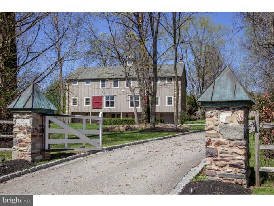 Original 1865 Pennsylvania Dutch Bank Barn which the current owners devoted two years to renovating and converting into the amazing home it is today. The open-air style of the homes interior is filled with light, a series of lofts, balconies, walkways and private rooms. Exposed original timber framing and custom iron railings all contribute to the prodigious architecture. Inspired by the magnificence of Stonehenge, the great room is dominated by an outstanding 30-foot stone fireplace. Wide plank cypress floors, original barn doors, stone and original details can be seen throughout the property.   Incorporating modern comfort on four levels of living space, this house exhibits versatility and ease. The main level boasts energy efficient, radiant heated floors; a guest suite proudly displays original wood floors and plenty of space for entertaining. The large master suite includes cathedral ceiling, exposed beams and bath, complete with steam shower. Positioned on an attractively landscaped lot, the property includes a secluded rear yard perfect for relaxing; with grill and dining area, terrace, outdoor fireplace and hot tub all just minutes from Chestnut Hill, Regional Rail, local shopping and dining. This is a one-of-a-kind property not to be underestimated or overlooked.