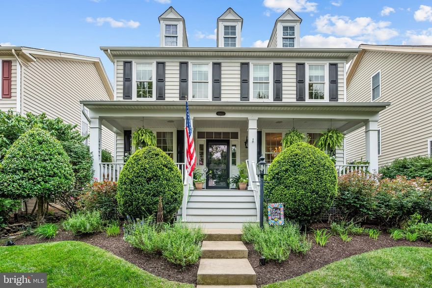 Unlike many of the other homes, this one has the 4th level Bedroom/Bonus Room!  Compare square footage.  Rear load 2 car garage! Welcome to your new home in Dominion Valley Country Club!. Nestled within this prestigious gated community, this stunning five-bedroom residence offers an unmatched lifestyle, complete with the premier Arnold Palmer–designed golf course, and a wealth of resort-style amenities. As you arrive, you’ll be greeted by a spacious composite (Trex) front porch, and beautifully landscaped grounds. Step inside the foyer to find formal living and dining rooms, gleaming hardwood floors, and a bright, open layout. The family room, featuring a gas fireplace, seamlessly connects to the gourmet kitchen. Here you’ll find white cabinetry, granite countertops, tile backsplash, wall ovens, a gas range, a pantry, and recent upgrades including a Bespoke refrigerator and new dishwasher. Off the kitchen are the mudroom, two-car garage, and access to the rear trex decking and patio. The three year old patio and rear yard is a perfect retreat— to enjoy your very own “secret garden". Upstairs, hardwood floors continue throughout four spacious bedrooms and two updated full baths. Each closet is outfitted with custom Elfa systems from The Container Store—even the laundry room and garage. The primary suite is a true retreat, featuring an updated bath with double vanity, soaking tub, and separate shower. The fourth level offers a bonus 5th bedroom with hardwood floors and an oversized walk-in closet. The fully finished lower level with egress provides a large recreation room, abundant storage, and a rough-in for an additional full bath. This home has been meticulously maintained and thoughtfully updated with all-new windows and screens, built-in audio in the porch and family room, new HVAC systems, a 2020 washer and dryer, and a new Rheem hot water heater. Located just minutes from shopping, dining, schools and major commuter routes, this home truly combines comfort, convenience, and the country club lifestyle. Come see why this property is a must-see!