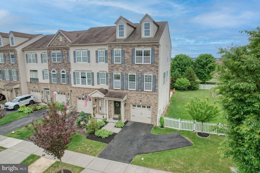 Don't miss this beautifully maintained 3-bedroom, 2.5-bath end-unit townhome located in the highly sought-after Village of Bayberry North. This spacious 2,025 square feet home offers upgraded indoor space and plenty of outdoor space—perfect for entertaining or relaxing at home.

Built in 2012, this beautifully updated three-story home offers modern elegance and functionality throughout. The open-concept main level boasts soaring 9-foot ceilings and is filled with natural light streaming through windows framed in custom craftsman trim. The upgraded kitchen is a true showstopper, featuring brand-new stainless steel appliances, stunning quartz countertops, and a stylish new backsplash that compliments the rich dark wood cabinetry and recessed lighting adding both warmth and sophistication.

The spacious layout flows effortlessly into the dining and living areas, where additional recessed lighting and a ceiling fan in the living room enhance the sense of space and style—perfect for entertaining guests or enjoying quiet evenings at home. An upgraded powder room with contemporary finishes completes the main level, adding both convenience and a touch of luxury.

Upstairs, the primary suite includes an en suite bathroom and a large walk-in closet. Two additional bedrooms and an additional full bathroom offer comfortable accommodations for family or guests. The lower level provides a versatile bonus space with 9-foot ceilings that can easily serve as a family room, home office, or playroom. This level also offers convenient laundry access and entry to the attached one-car garage, making everyday living both seamless and efficient.

Set on a 0.13-acre corner lot, this end-unit property offers more outdoor space than most, and is ideally situated directly across from open space and scenic community walking trails. Step outside to enjoy a large custom patio, perfect for summer gatherings, and an upper deck ideal for morning coffee or evening sunsets. The fenced-in yard provides a safe and private area for pets, play, or gardening, and the expansive side yard offers rare additional space you won’t often find in townhome living.

Located close to local parks, shopping, dining, and major commuter routes, this home is the perfect blend of comfort, convenience, and community living. Don’t miss your chance to call 1591 E Matisse Drive your home!