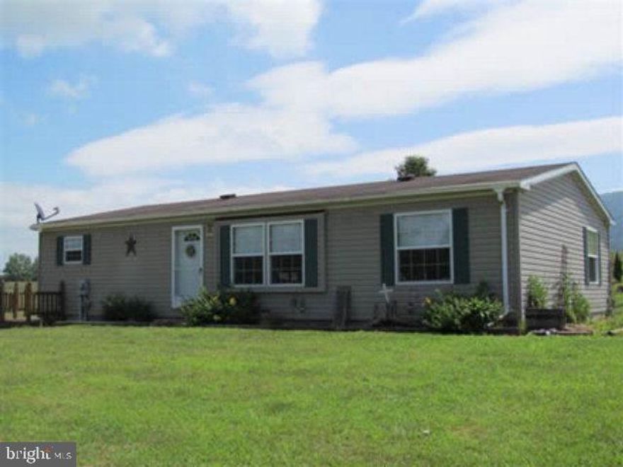 3 Bedroom, 2 bath doublewide home built in 2001 on 1.82 acres in a country setting. Lovely country eat in kitchen, master bedroom suite, den in the basement, Central Air and your choice of Oil forced Air or woodstove for heat, deck overlooking the valley, above ground pool and spacious detached garage. Call today for your private tour!