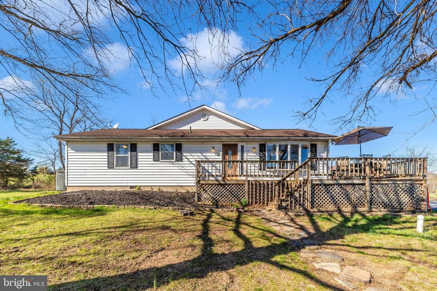 Back on the market!     The sellers have updated, repaired or otherwise addressed many issues from a previous home inspection.   Here’s your chance to own a nice farmette in northern Frederick County.   This ranch-style home sits on 15.53 acres with incredible mountain views.  Designed for both comfort and functionality, this home features 3 spacious bedrooms, 3 full bathrooms, and an open layout.  Hardwood floors throughout the main level.  The expansive kitchen has newer appliances including a wall mounted double-oven, cooktop, fridge & dishwasher, and washer/dryer nook.  Just off the kitchen is a large great room with cathedral ceilings and floor-to-ceiling windows providing extensive natural light.  There is also a dedicated home office with built-in shelving offering the perfect workspace.   The finished basement provides additional living or entertainment space along with a full bath.  The property includes two new 26 x 16 run-in sheds, a detached oversized garage, storage shed and fenced rear yard.  There is also new fencing on 5 acres, with water & electric running to the pasture, and a small seasonal pond.  Additionally, there is a pad site already prepped for a 30 x 60 building.   Country living with the convenience of nearby Emmitsburg amenities, as well as easy access to Frederick, Gettysburg, and major commuter routes.