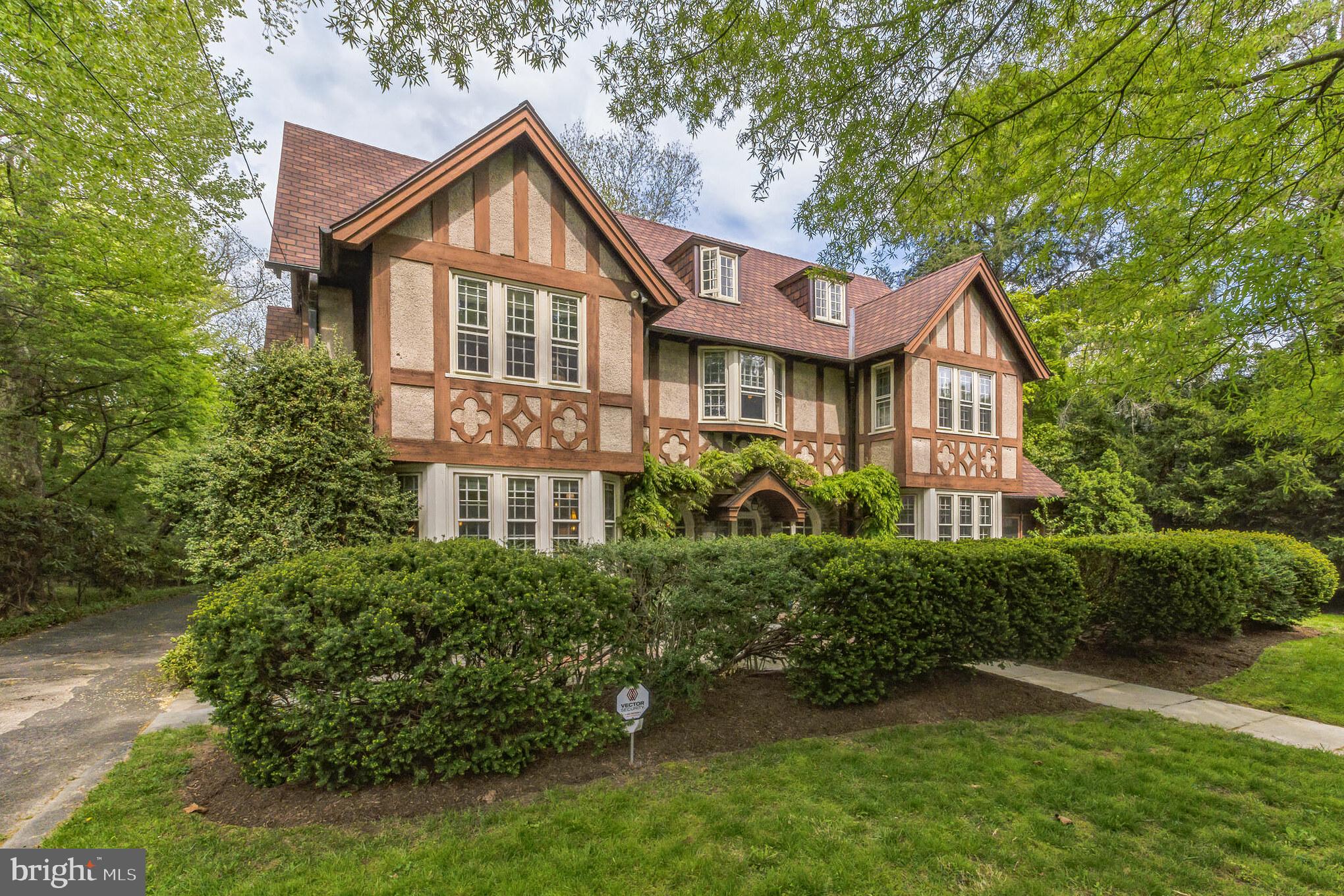 Elegant stone Colonial home with original stone wall boundary from the 1800s, in desirable Chestnut Hill! Front entryway has a stone fountain and basin, which welcomes you to this 7 Bedroom, 5 Bathroom (3 full, 2 half) home, surrounded by beautiful established landscaping that flowers through the growing season, including flowering trees, for maximum privacy. Spacious foyer welcomes you to beautiful finished hardwood floors, numerous windows that look out to trees and landscaped views, and a dual staircase. The main level has a large Living Room with wood-burning fireplace, a Family Room/Sitting Room with built-ins and a bench-seat window, a formal Dining Room with a modern chandelier and pocket doors, and an eat-in Kitchen. The Kitchen features glass-front cabinetry for your favorite dishes and prized possessions, a butler’s pantry, large jalousie windows that open to the courtyard, and a cozy breakfast nook. There are 2 mudrooms: one off the kitchen and one at the front entrance that opens into the foyer, with 6 large glass doors to let the sunshine in! Follow one of two staircases to the second floor, where you will find 5 Bedrooms, including the Primary, which features a private en-suite and custom walk-in closet. The Laundry Room is also conveniently located on the second floor with a half bath. The third floor has 2 Bedrooms and a full Bathroom. Enclosed porch looks out to the secluded back yard, with plenty of places to set up your favorite grill, fire pit, and patio furniture—perfect for relaxing and entertaining! The home receives generous east/west sunlight throughout the day. Enjoy the front and rear yards with formal gardens, beautiful courtyards, and mature wooded area. Courtyard in the back is very secluded by cherry blossoms and magnolia trees. 3 different zones for heating and cooling! Convenient to many great shops and restaurants in Chestnut Hill, including Top of the Hill Coffee Shop, and the Night Kitchen Bakery, as well as a local bookstore, pet store, and specialty stores! 25 minutes from Center City. Trees on the property include Japanese Maple, Dogwood, Birch, Hawthorn and Cherry. There is a detached 2-car garage with an attic. Call now to schedule your private showing!