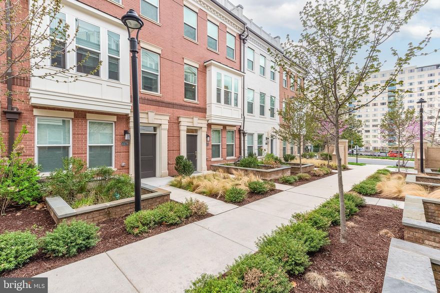 Sophisticated 4-level ELEVATOR townhome steps to Grosvenor-Strathmore Metro offers true lock-and-leave luxury and an unbeatable North Bethesda location. Better than new and built in 2022, this 4BR/4BA home features wide-plank hardwoods, soaring ceilings, and a bright open main level anchored by a chef’s kitchen with quartz counters, 42" cabinets, tile backsplash, stainless appliances and large island. The private elevator services all levels, creating effortless everyday living and ideal aging in place. Retreat to the spacious bedroom suites with stylish tile baths, or enjoy two incredible outdoor spaces: a main-level deck plus a spacious rooftop terrace perfect for entertaining or relaxing. Energy-efficient systems, smart thermostat, tankless hot water, and low-maintenance exterior complete the package. Sought-after Townes at Grosvenor Place is minutes to Strathmore, Pike & Rose, Wildwood, Rock Creek Park, NIH, Walter Reed, I-270 and I-495.