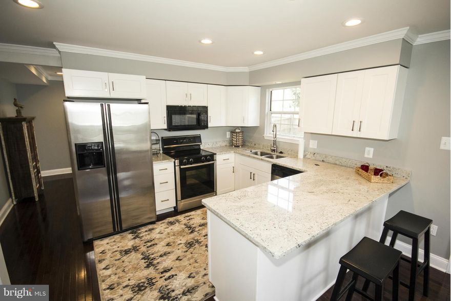 Gorgeous Renovated Colonial with 4 BR 2.5 BA. Kitchen features New Shaker Cabinets with Colonial White Granite and breakfast bar. Hardwood floors throughout main level with recessed lighting. Updated baths. Spacious bedrooms with private master bath.Large finished basement. Beautiful new carpet.Deck w/fenced yard, great for entertaining. Perfect location. Conveniently located near 32 and 26!