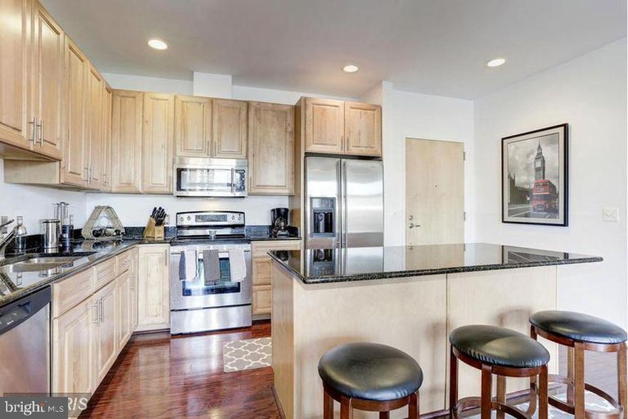 RESORT STYLE LIVING IN THE CITY!   RARELY AVAILABLE one bed+ bath  condo in one of Canton's premier buildings.    Floor to ceiling windows,  open floor plan and hardwood floors. CHEF'S Kitchen with tons of cabinet space + oversized island.   The unit has a spacious master bedroom with WIC. and spa like bath.   Located in  a secure building with state of the art gym and garage parking!!!  Schedule your appointment today!  This unit will not last.  AVAILABLE DECEMBER 1.    PETS ARE CASE BY CASE