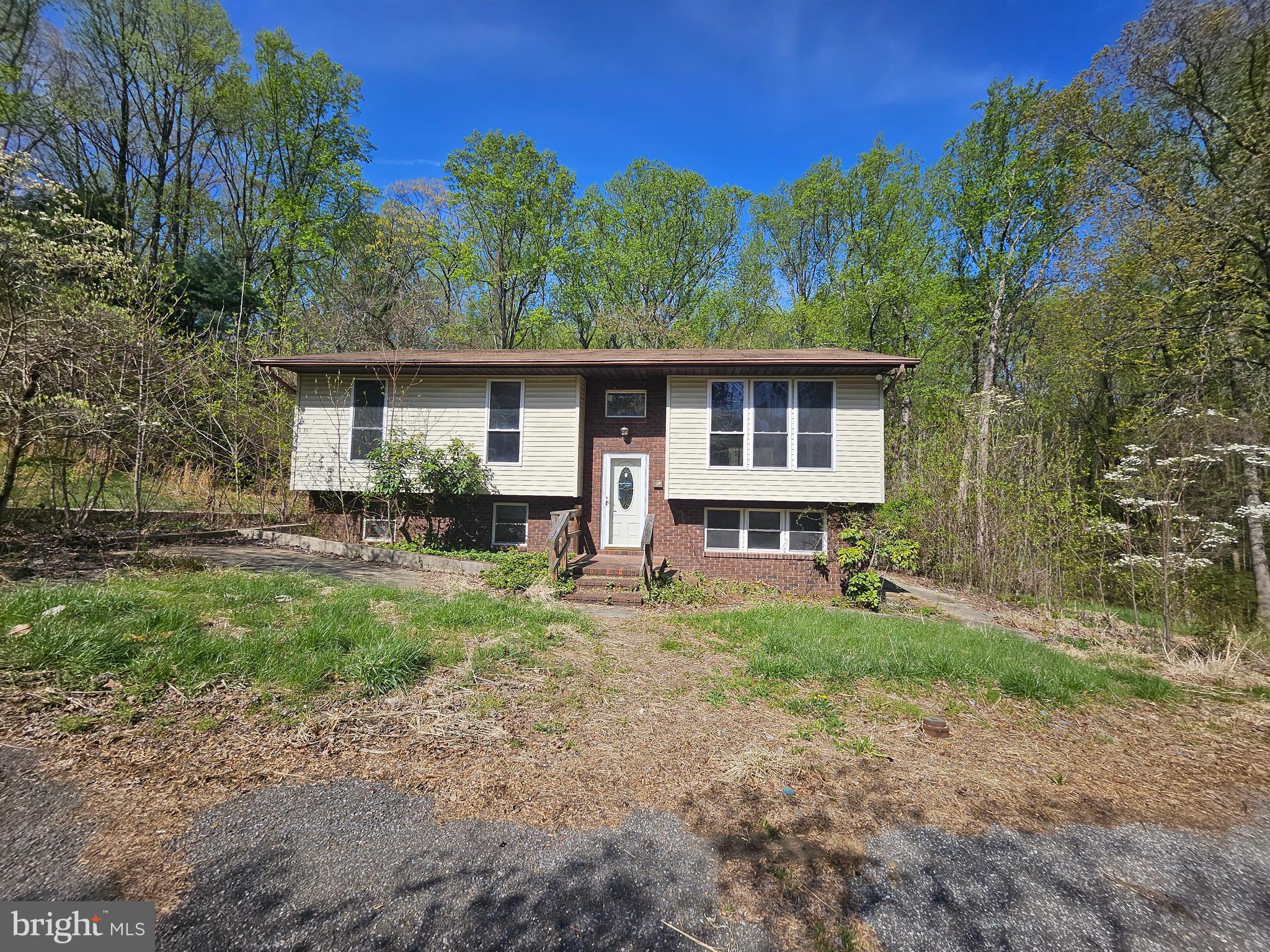 This is a Fannie Mae Reverse Mortgage Foreclosure. Seller must comply with HUD Guidelines 24 CFR 206.125. There are so many possibilities with this amazing property. A large split foyer, nestled among trees with a circular driveway and detached garage with office space. The main level has three bedrooms, two full baths, living room, dining room, kitchen and sliders to the rear deck at the dining room and primary bedroom. The lower level has it's own kitchen, rear entrances, two bedrooms, den and full bath. There is a slider from the rec room to the rear patio. There is a slider from the den to the side patio. There is a rear door entry to the kitchen as well. There is so much to see at this property.