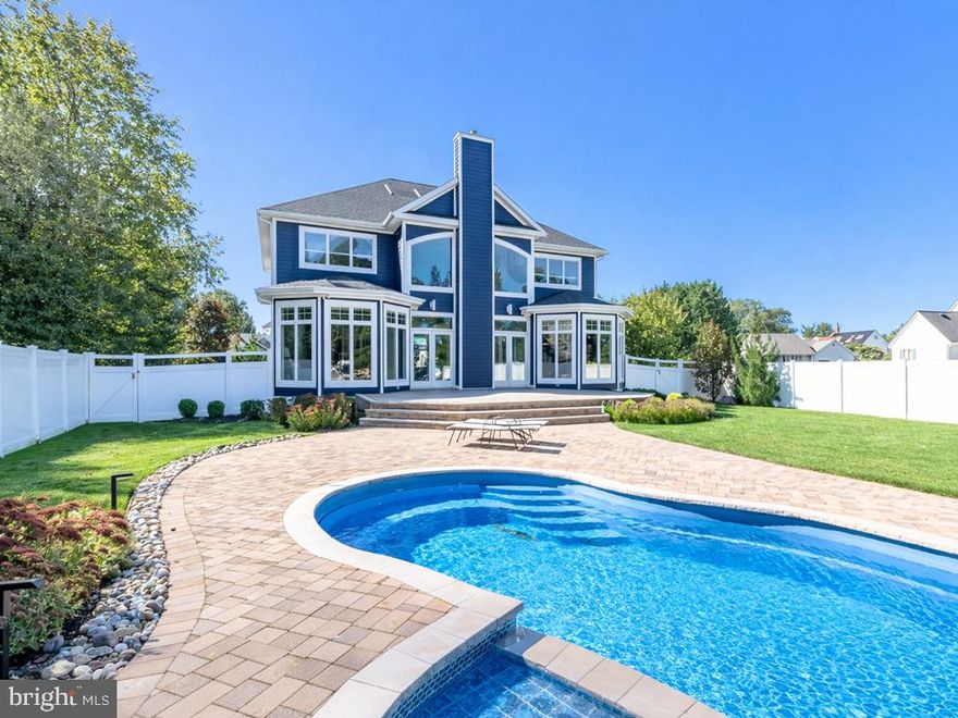 Waterfront home on Red Mill Pond with a private dock, pool, and resort-style entertaining.

Set on the shores of Red Mill Pond, a private 180-acre freshwater lake accessible only to its surrounding neighborhoods, this beautifully updated 5,200-square-foot home offers a rare combination of ​waterfront recreation and refined coastal living just minutes from the beaches of Lewes.​ 

Wakeboard, surf, paddleboard, or cruise directly from your private dock with boat access and jet ski lift, then come home to a resort-style backyard featuring a custom in-ground pool - complete with a heater / chiller,  expansive paver patio, and beautifully landscaped fenced yard designed for entertaining.

Inside, soaring ceilings and walls of windows fill the home with natural light and frame tranquil water views. The open main living area features a dramatic two-story great room, updated finishes throughout, and seamless indoor-outdoor flow.​ The chef's kitchen anchors the heart of the home with custom cabinetry, walnut butcher-block counters, high-efficiency stainless appliances, and a generous island perfect for gathering with family and friends​. 

Recent updates include a new roof with integrated solar panels, fresh interior and exterior paint, newly remodeled spa-inspired bathrooms, and modern upgrades throughout - truly move-in ready.​ 

The home is built for modern living with zoned HVAC, a whole-house generator, EV charger, and energy-efficient systems designed to keep operating costs low and comfort high.​ Additional highlights include dual owner's suites, walk-in closets, and an oversized three-car garage with space for a home gym or recreational storage.

Private ​pond. Private dock. Minutes from the coast. ​A​ rare offering where peaceful water views and outdoor recreation become part of everyday life.