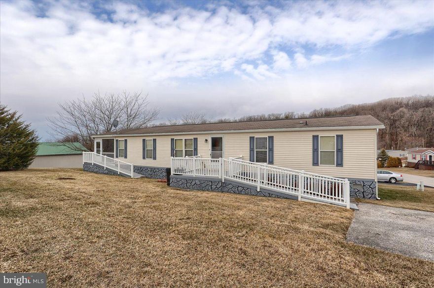 Eagle View Mobile Home Community is a well maintained community overlooking Hanover.  This home 3 bedroom, 2 bath, spacious home is looking for a new owner.  All three bedroom are roomy with large closets. Primary bedroom offers a walk in closet and a full bath with large, easily accessible stand up shower.  There is a private sitting room or office just outside the primary bedroom.  The rear of the house has a screened in and covered porch with a breathtaking view. There are two ramp entrances to this home making it very accessible. This property is all electric, but community propane is  available.  This home is ready for your welcoming touches,  so don't miss out. Schedule your showing today! Potential buyers MUST be park approved.