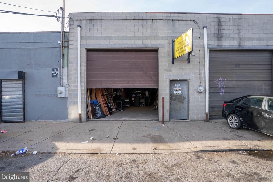 4930 Valley St is an open, warehouse-style building with a bathroom and an oversized garage door at the front.  A concrete blocks building with 17' high interior ceilings. This commercial space would be ideal for a mechanic, a workshop, securely storing large vehicles, or general storage. Its location is close to residential housing and businesses along Frankford Ave.  Roof installed 2014 & Roof silver coated 2023  There's also easy access to public transit, I-95, and Rt-1/Roosevelt Blvd. Schedule your showing today!