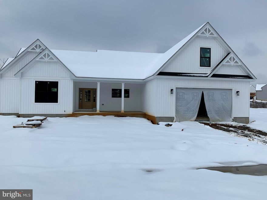 UNDER CONSTRUCTION IN UPSCALE NEIGHBORHOOD ON A 0.5 ACRE LOT. COMPLETION ANTICIPATED IN MID TO LATE APRIL. Open floor plan rancher on a full basement with two car garage. Features include: Large Great Room / Spacious Kitchen with stainless steel appliances, quartz counters, island, and bumped out dining table area / Master Suite with walk in closet / Master Bath with soaking tub and separate ceramic shower / Full Basement with roughed in plumbing for a future full bath.