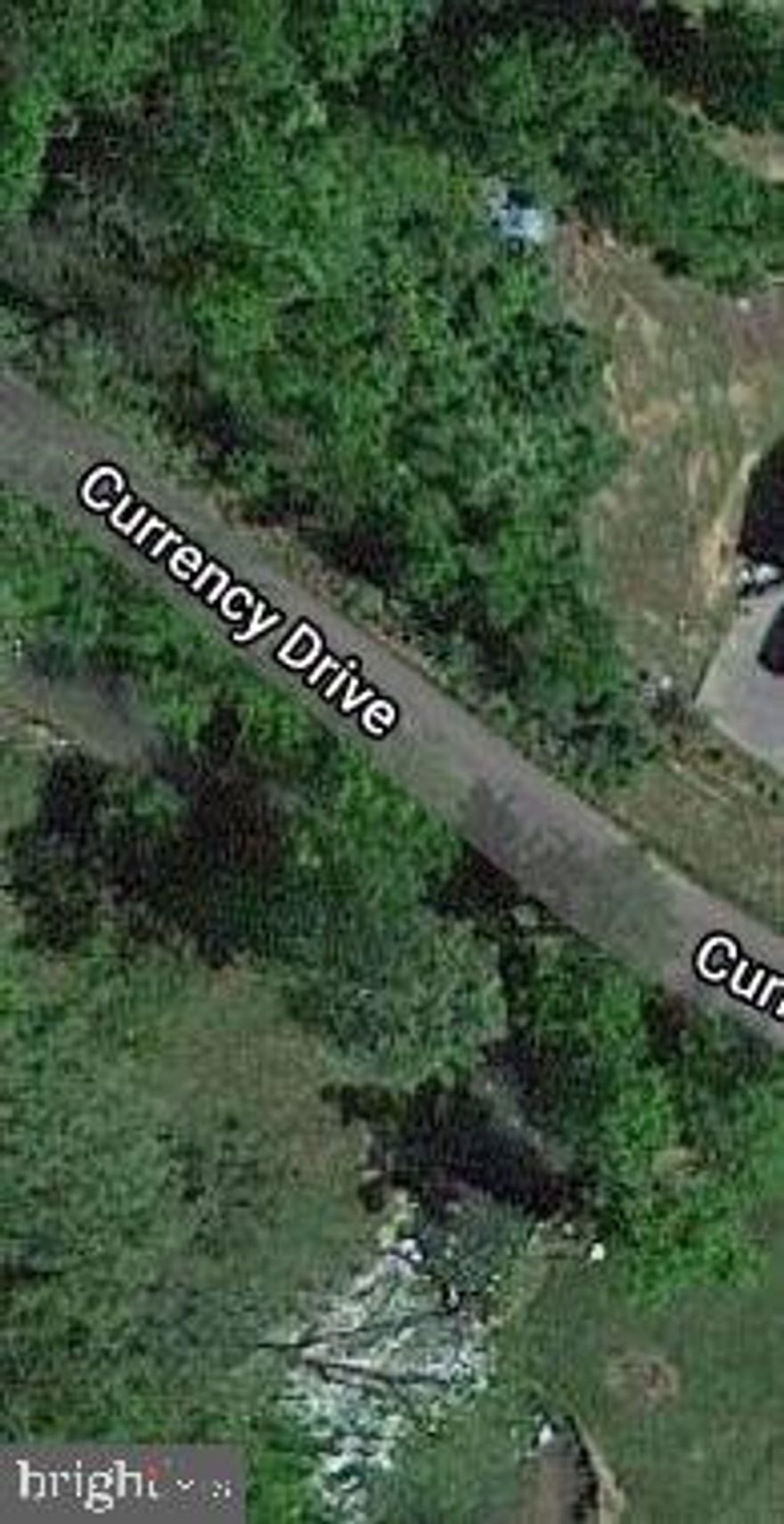 This lush home site is just under an acre and is the perfect place for your dream home or getaway! Beautiful mature trees cover the property and Mill Creek runs through it (and it's stocked with fish frequently by the DNR!). There's a nice building site out of the floodplain.  Close to amenities and a great commuter location to VA. The owner is also offering C-29 Currency and C-40 Currency if you're looking for more land, and the seller will consider financing with 20% down (with a seller- approved credit report). Lightly restricted.  Call now!